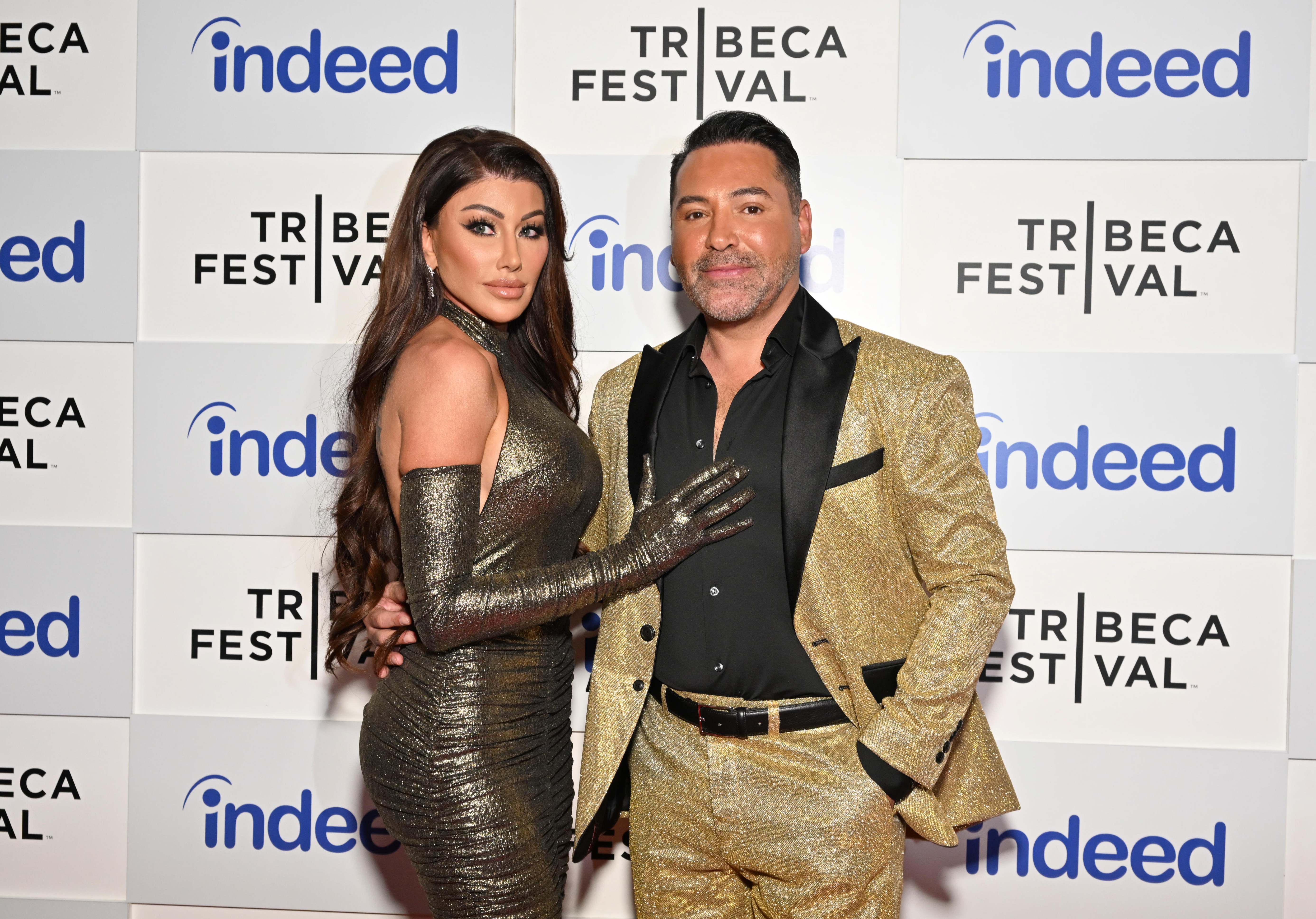 Holly Sonders and Oscar De La Hoya attend The HBO Sports Documentary "The Golden Boy" premiere at the Tribeca Festival 2023, on June 9, 2023, in New York City. | Source: Getty Images
