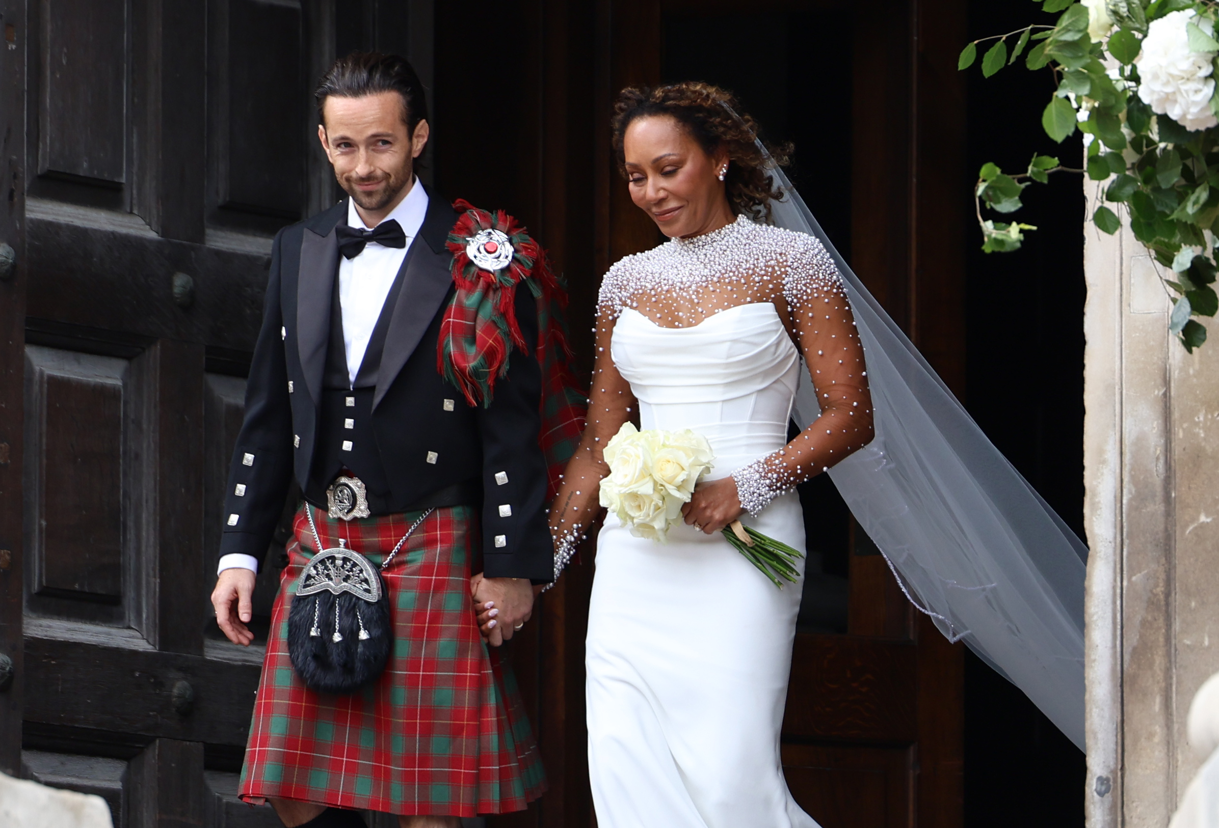 Spice Girl Melanie Brown, Mel B, and her husband hairstylist Rory McPhee as they leave St Paul's Cathedral, London on July 5, 2025 | Source: Getty Images