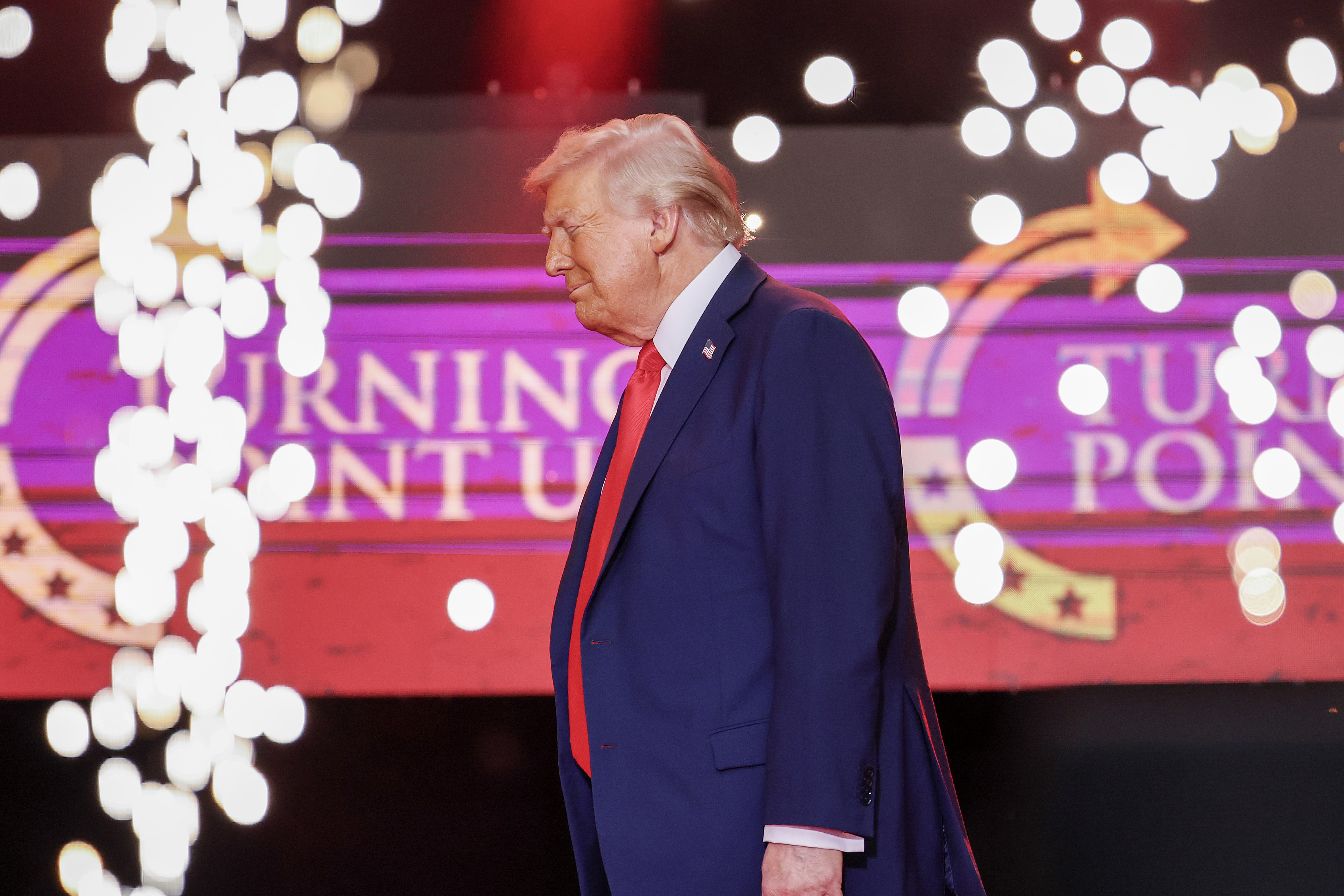 U.S. President Donald Trump walks onstage to deliver a speech at Charlie Kirk's memorial service in Glendale, Arizona on September 21, 2025. | Source: Getty Images