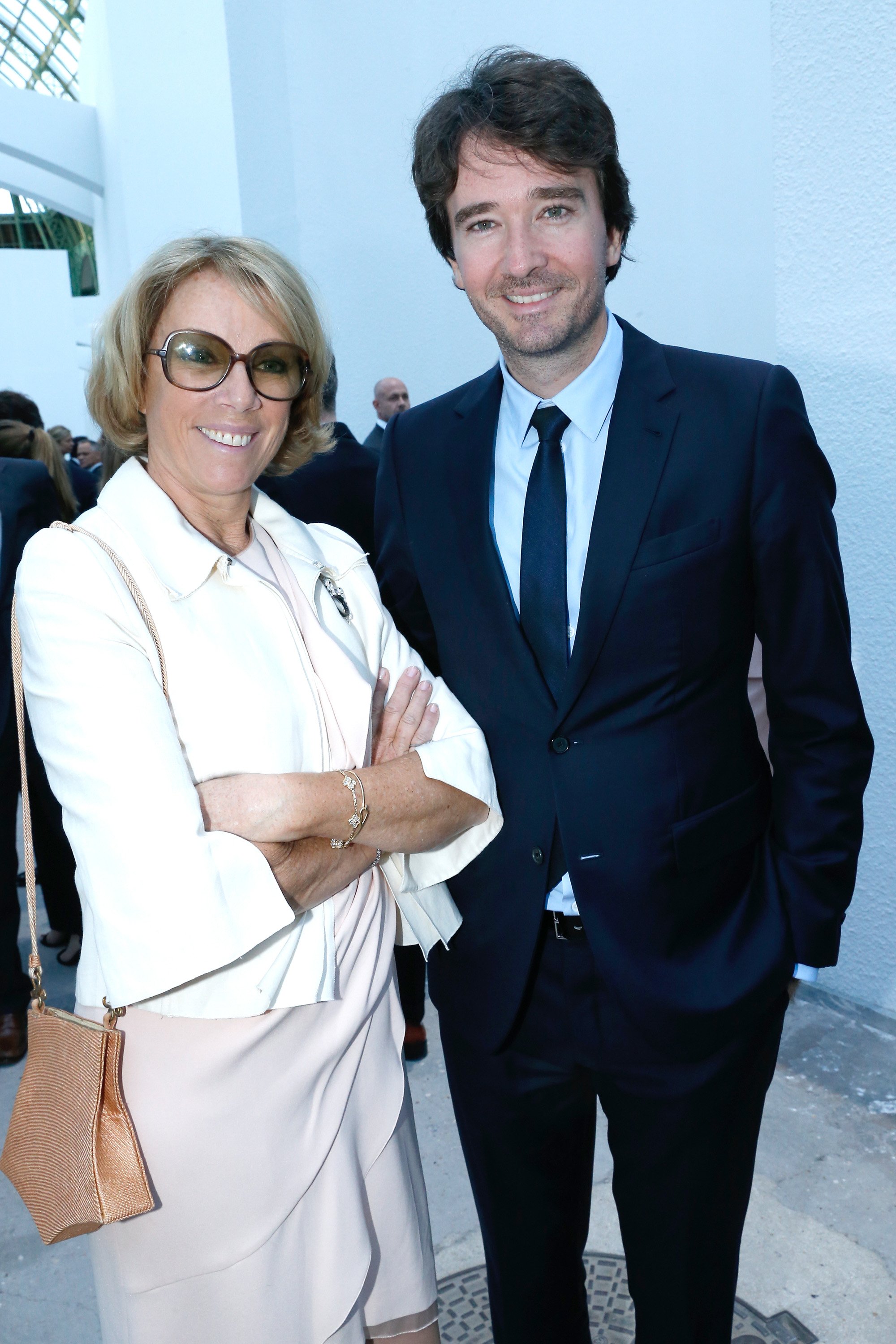 Anne Dewavrin her son Antoine Arnault at 'The strange city' Exhibition in Paris on May 13, 2014 | Source: Getty Images