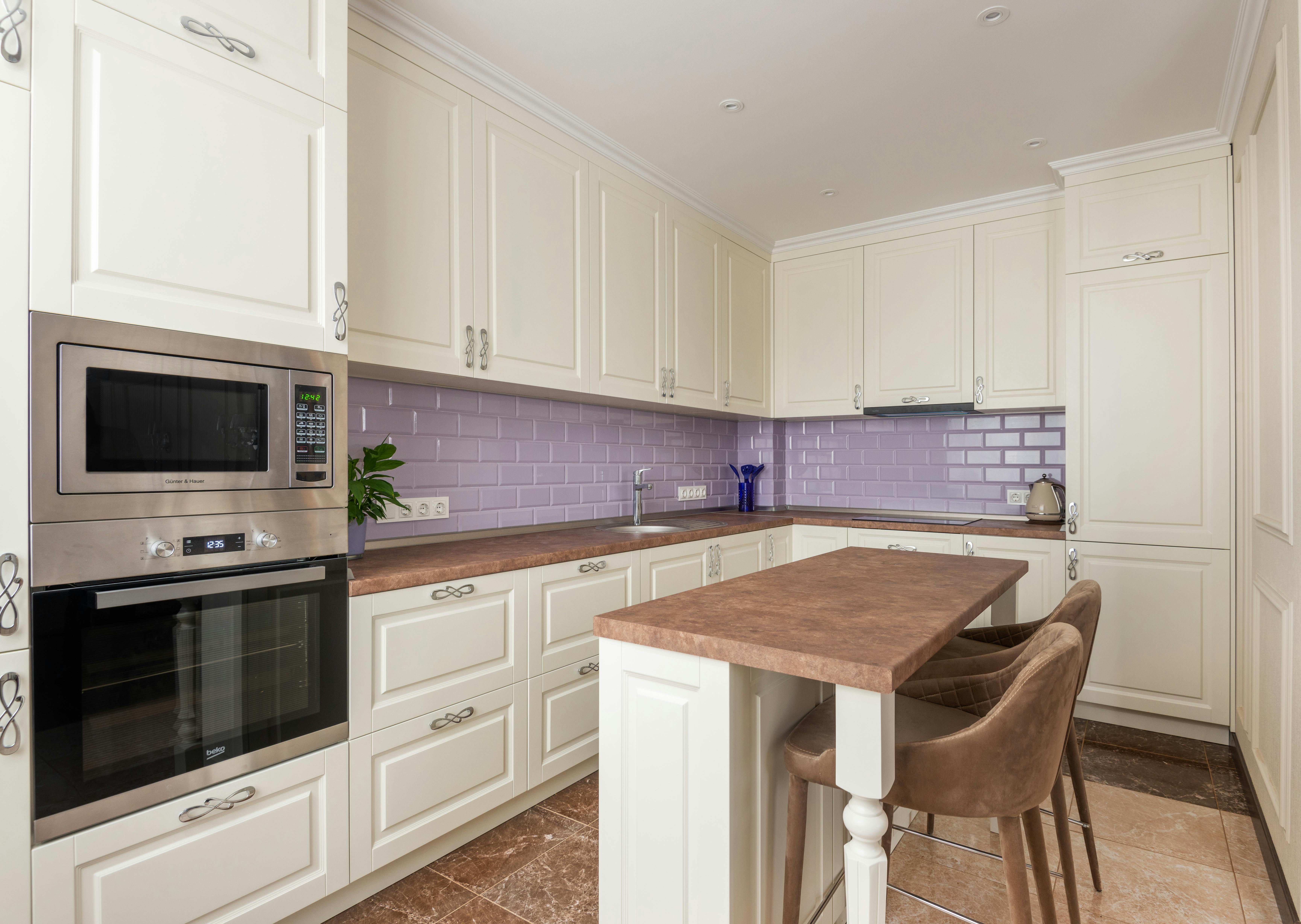 Painted kitchen cabinets with accent handles | Source: Pexels