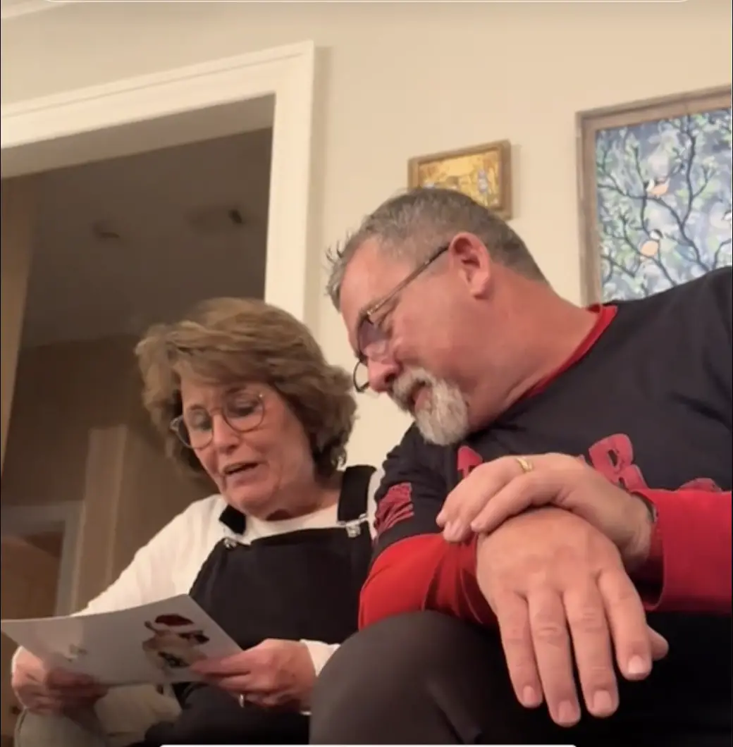 Ted Lawver's wife reading the Christmas card | Source: TikTok/lindseyswagmom