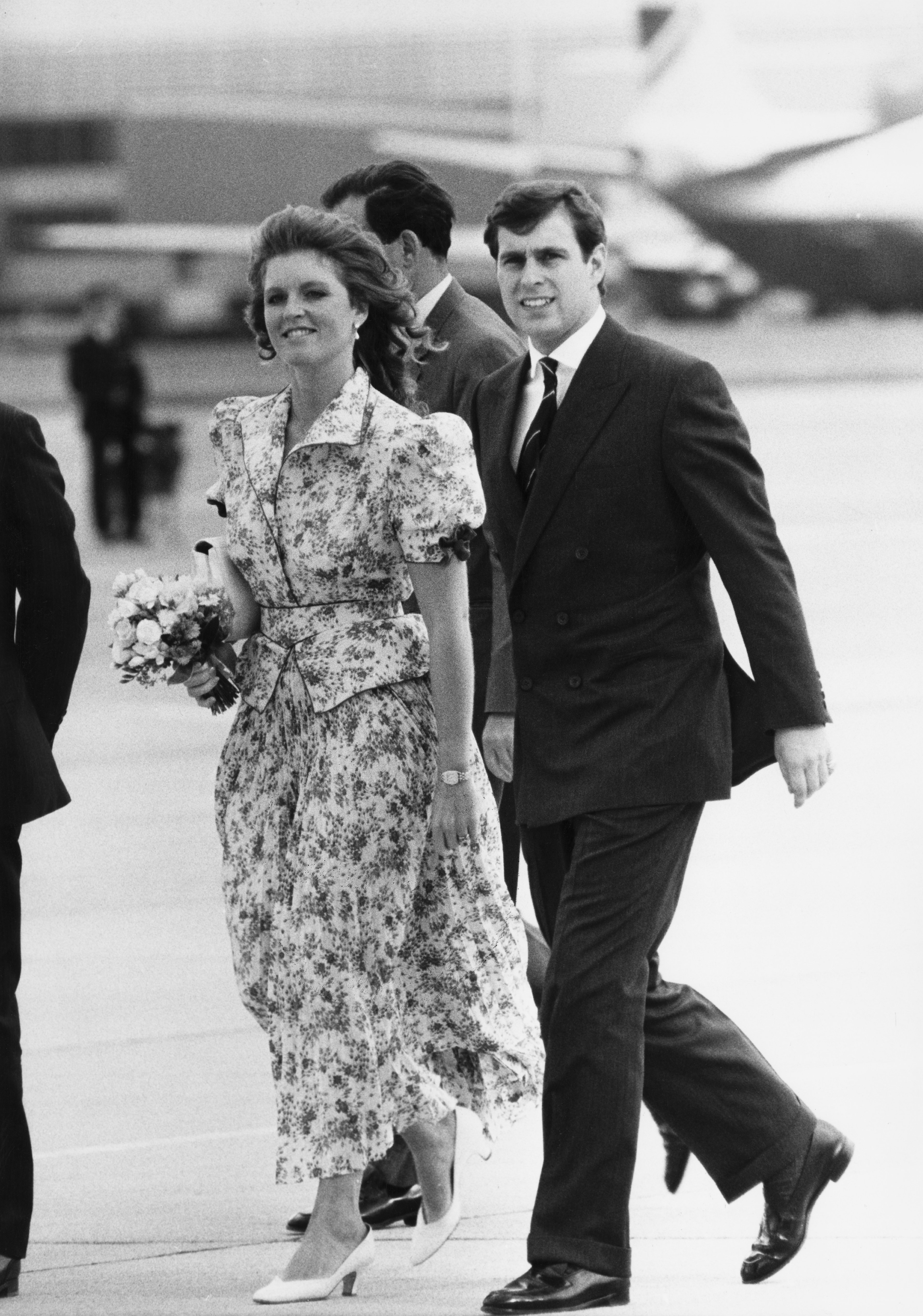 Prince Andrew and his wife Sarah (nee Ferguson) at Heathrow Airport as they leave for their honeymoon, 23rd July 1986. | Source: Getty Images
