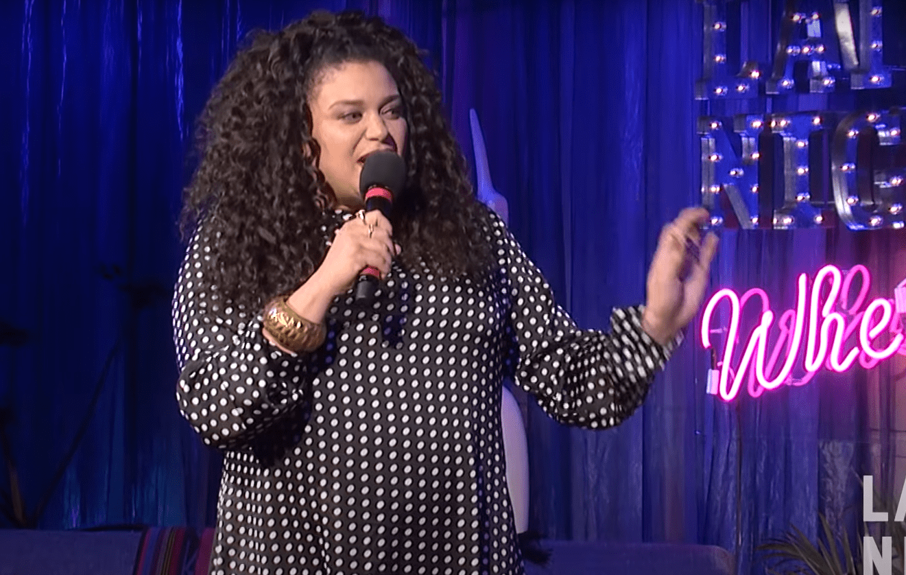 Standup comedian, Michelle Buteau speaks on a show on how she loves being 40. | Photo: YouTube/WNYCStudios