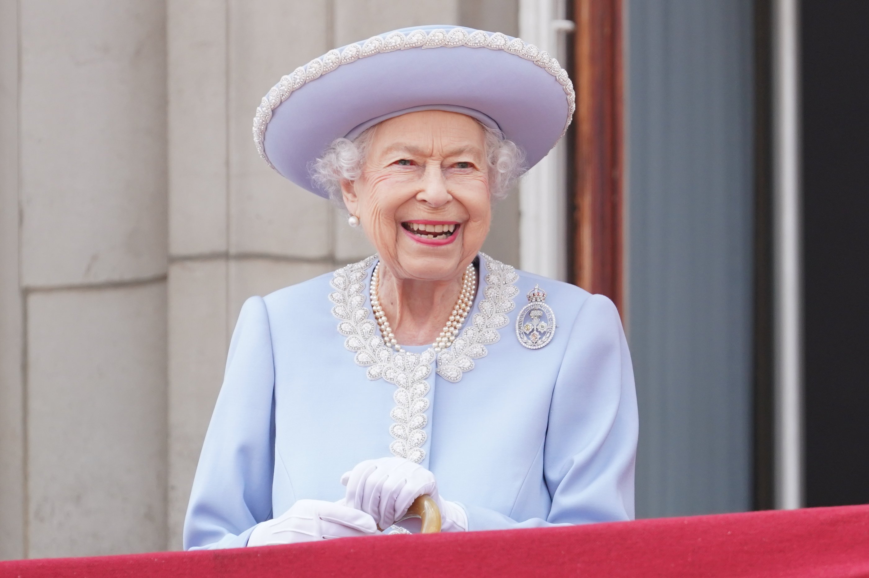 Queen Elizabeth II watches from the balcony of Buckingham Palace during the Trooping the Colour parade on June 2, 2022, in London, England. | Source: Getty Images