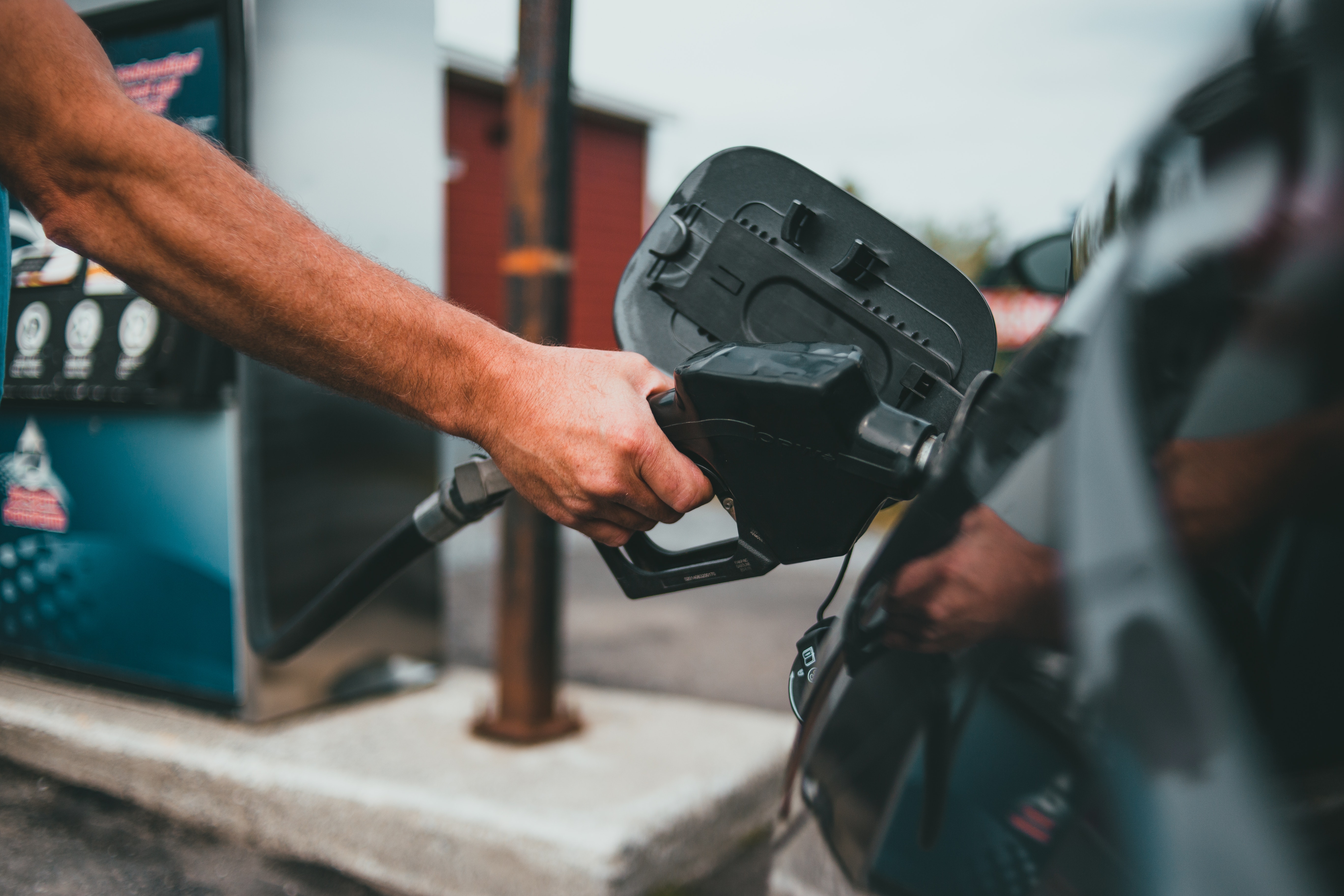 Person putting gasoline in car | Source: Pexels