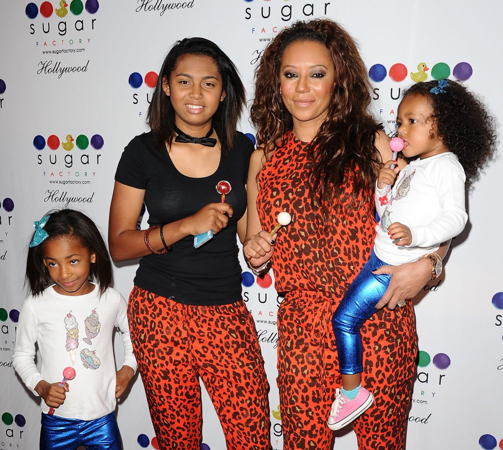 Melanie "Mel B" Brown and her daughters attend the grand opening of Sugar Factory Hollywood on November 13, 2013. | Photo: Getty Images