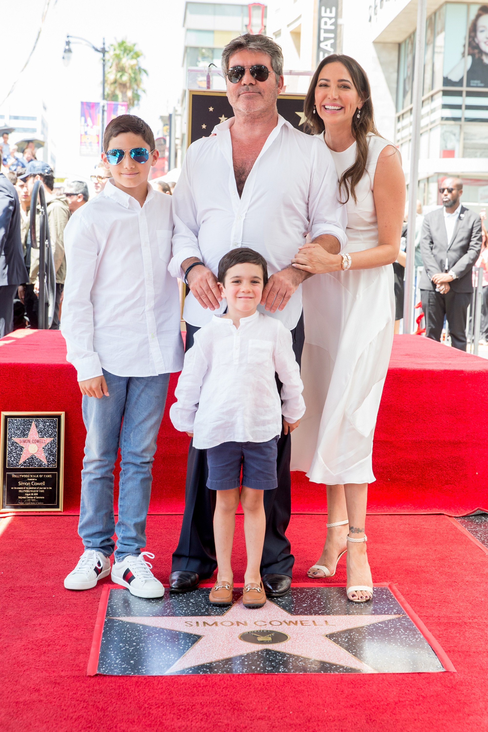 Simon Cowell, Lauren Silverman, Eric Cowell and Adam Silverman at a ceremony honoring Simon with a star on the Hollywood Walk of Fame on August 22, 2018 in Hollywood, California | Source: Getty Images