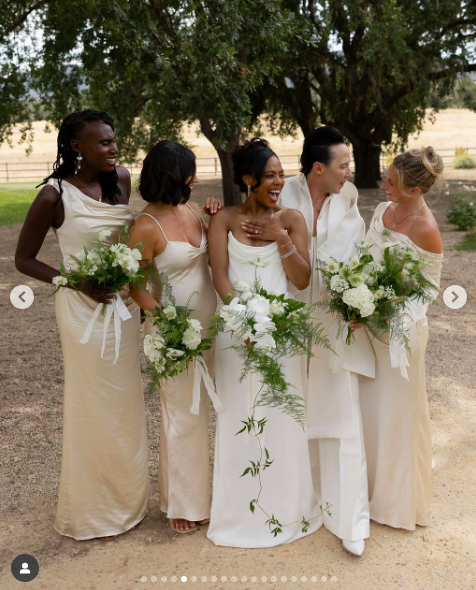 Britt Stewart with her bridal party. | Source: Instagram/samkoma.world and maksmaakphoto