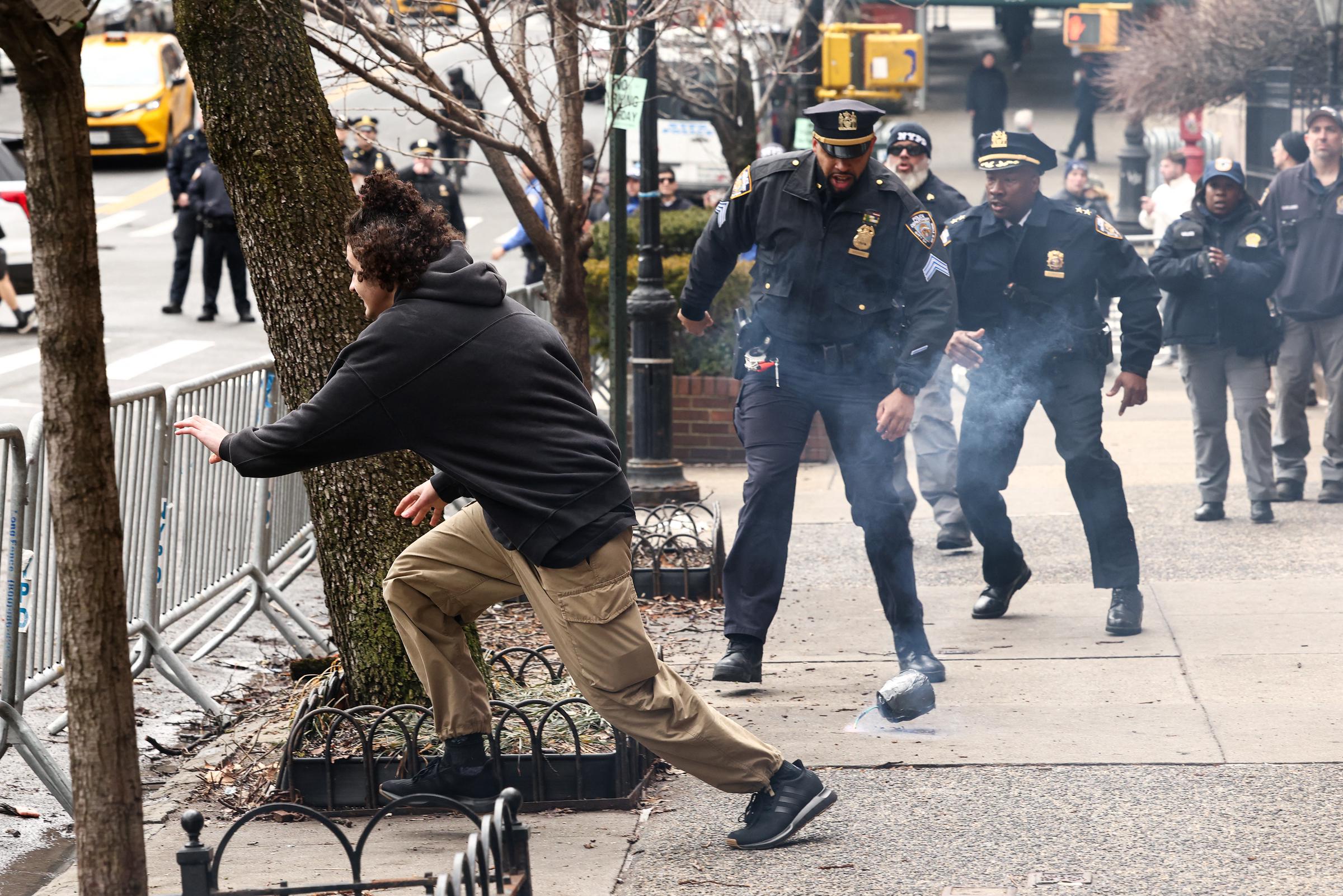 One of the counter-protesters fleeing from police officers after the explosive device was dropped in New York on March 7, 2026. | Source: Getty Images