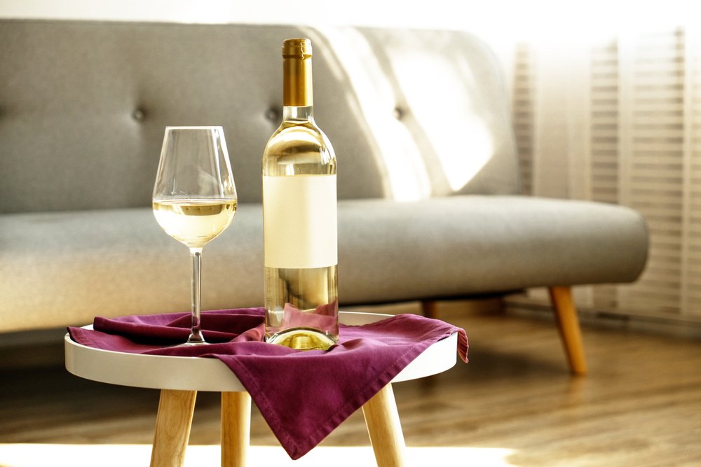 A bottle and wine glass. | Photo: Shutterstock