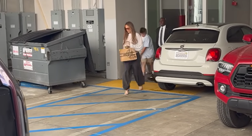 Jennifer Lopez and Samuel Affleck exit a building during a shopping outing, from a video dated September 7, 2025 | Source: YouTube/@x17online