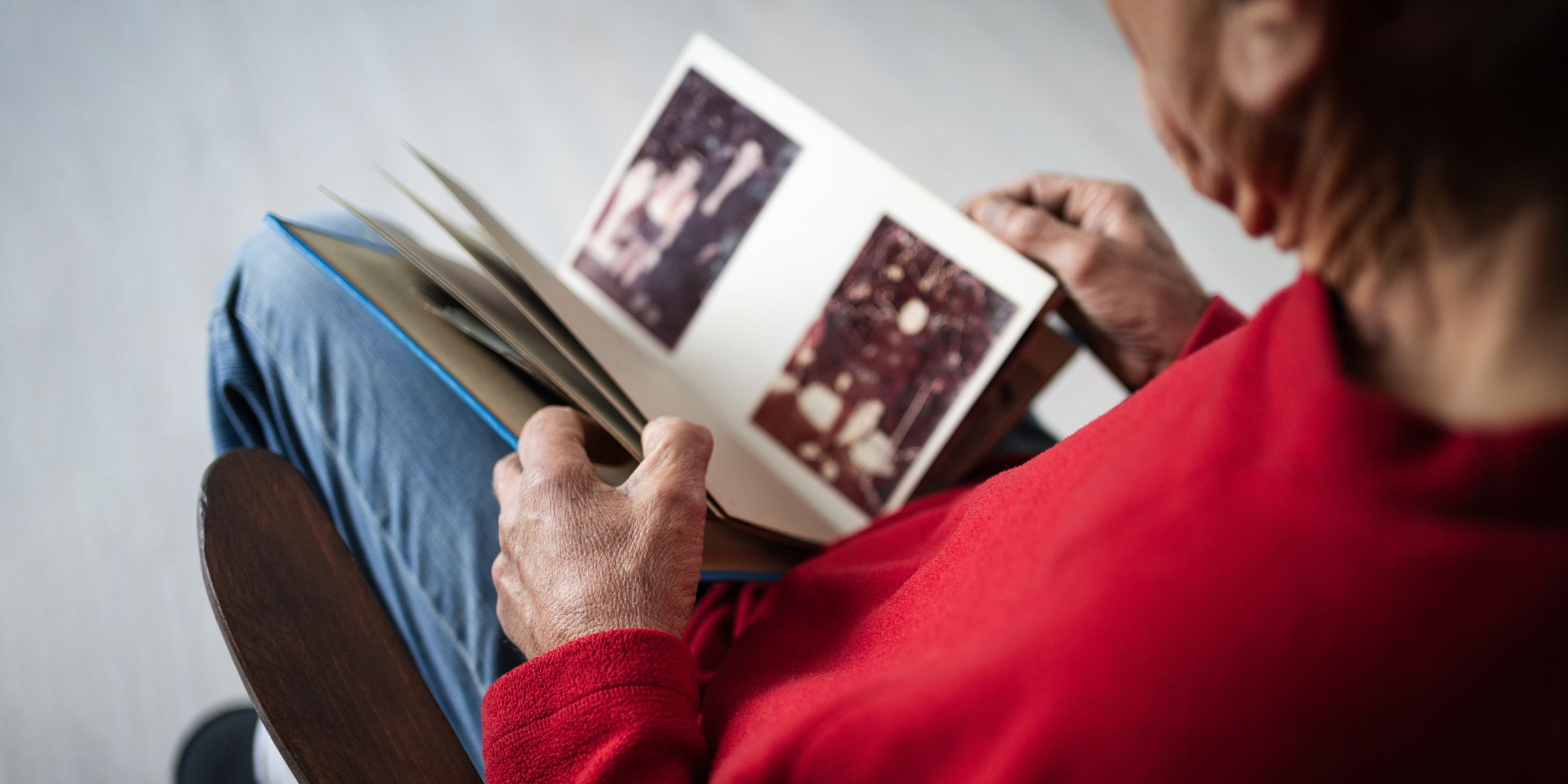 A person looking at a photo album | Source: Shutterstock