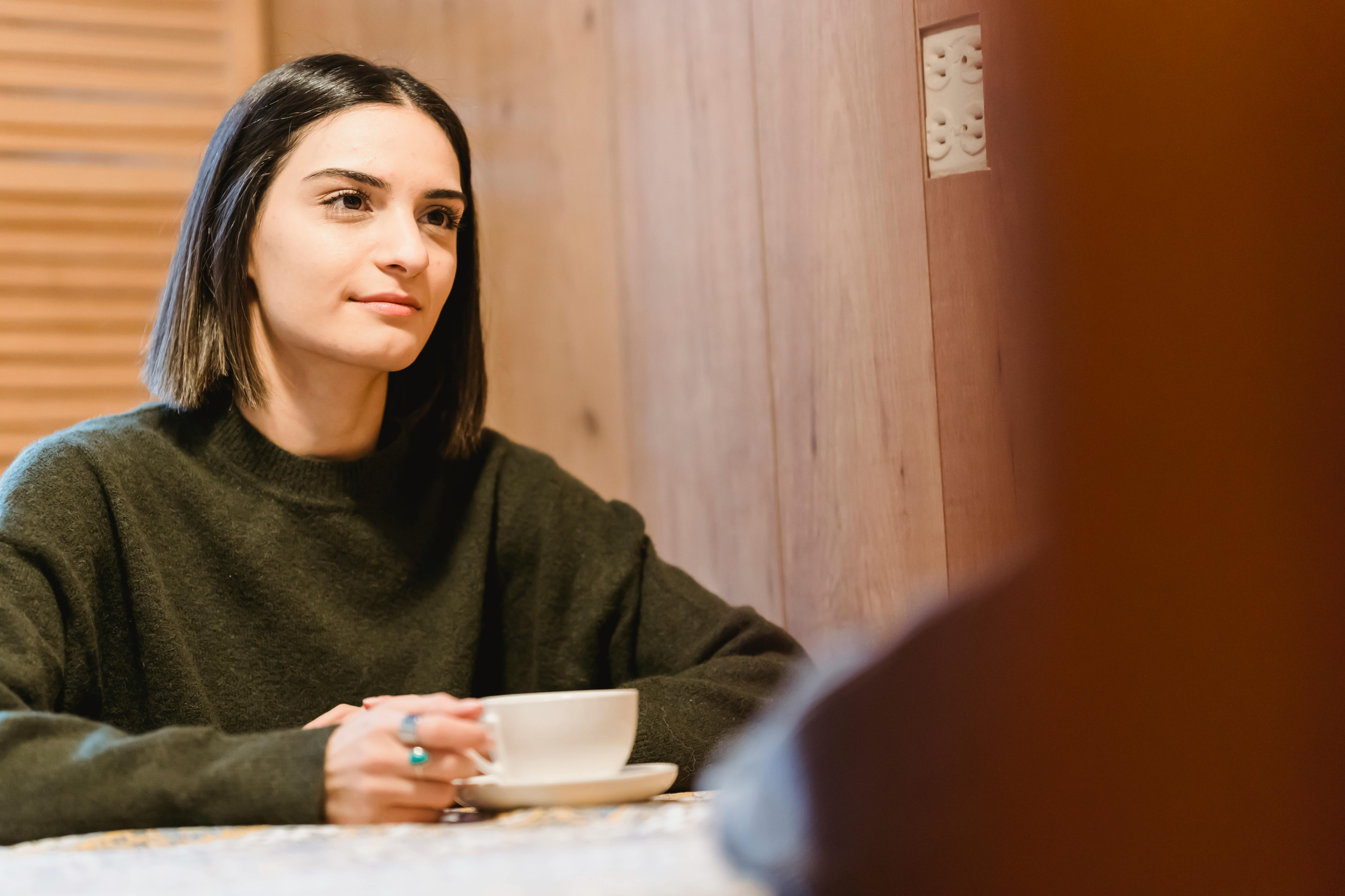 A woman with a cup of coffee | Source: Pexels