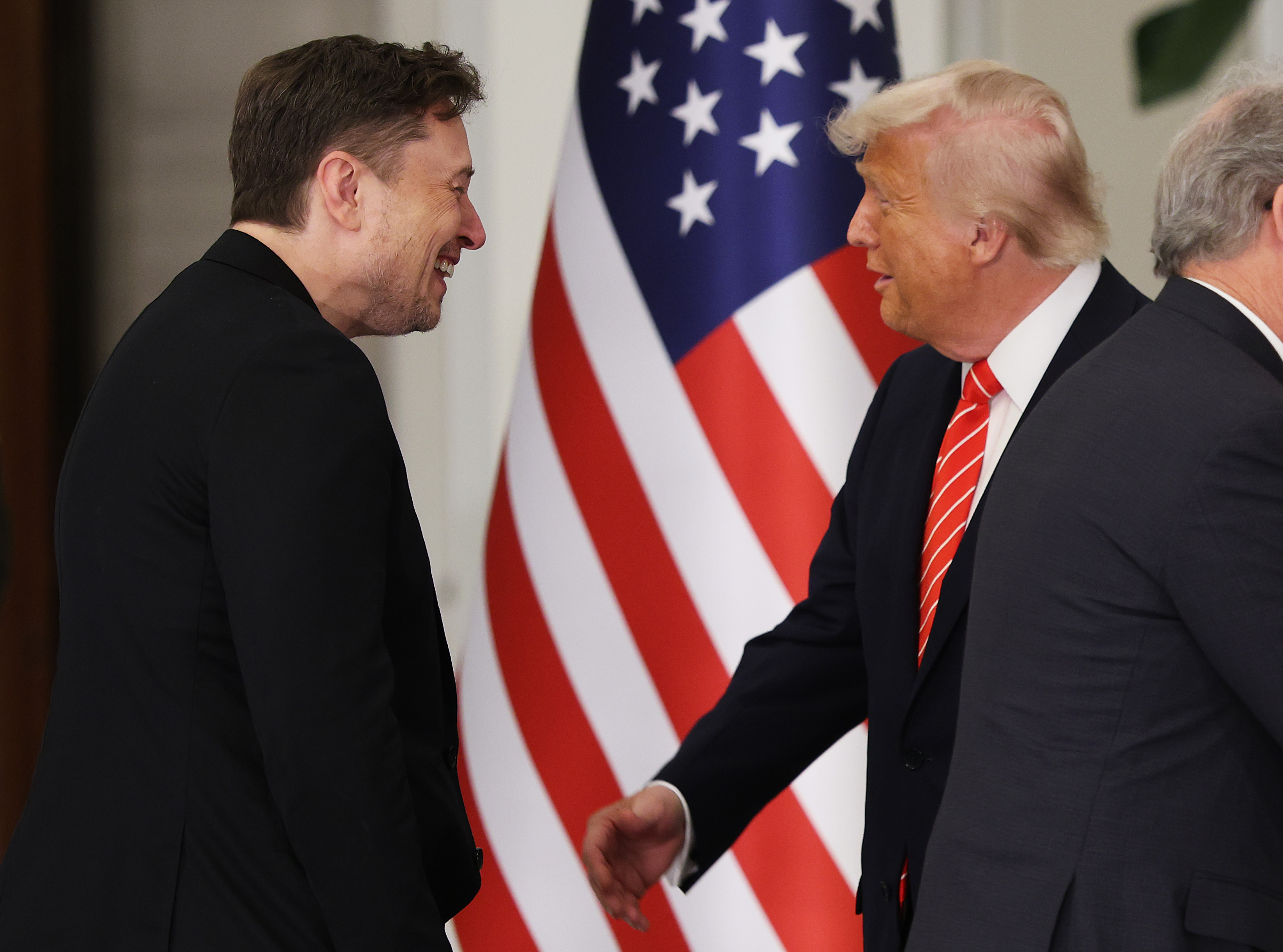 President Donald J. Trump greets Elon Musk before a state dinner on May 14, 2025, in Doha, Qatar | Source: Getty Images