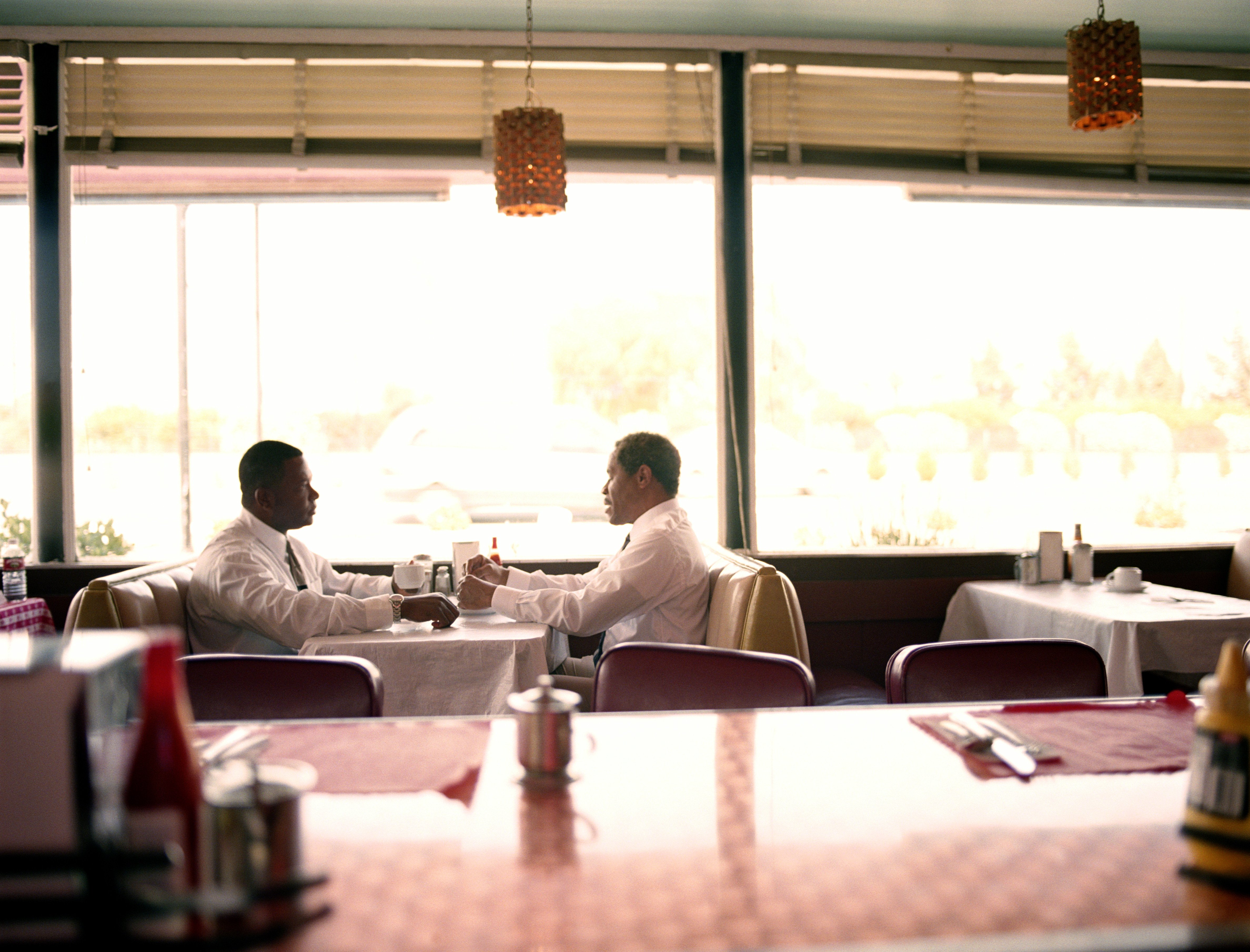 The two firefighters were having coffee at the diner. | Source: Getty Images
