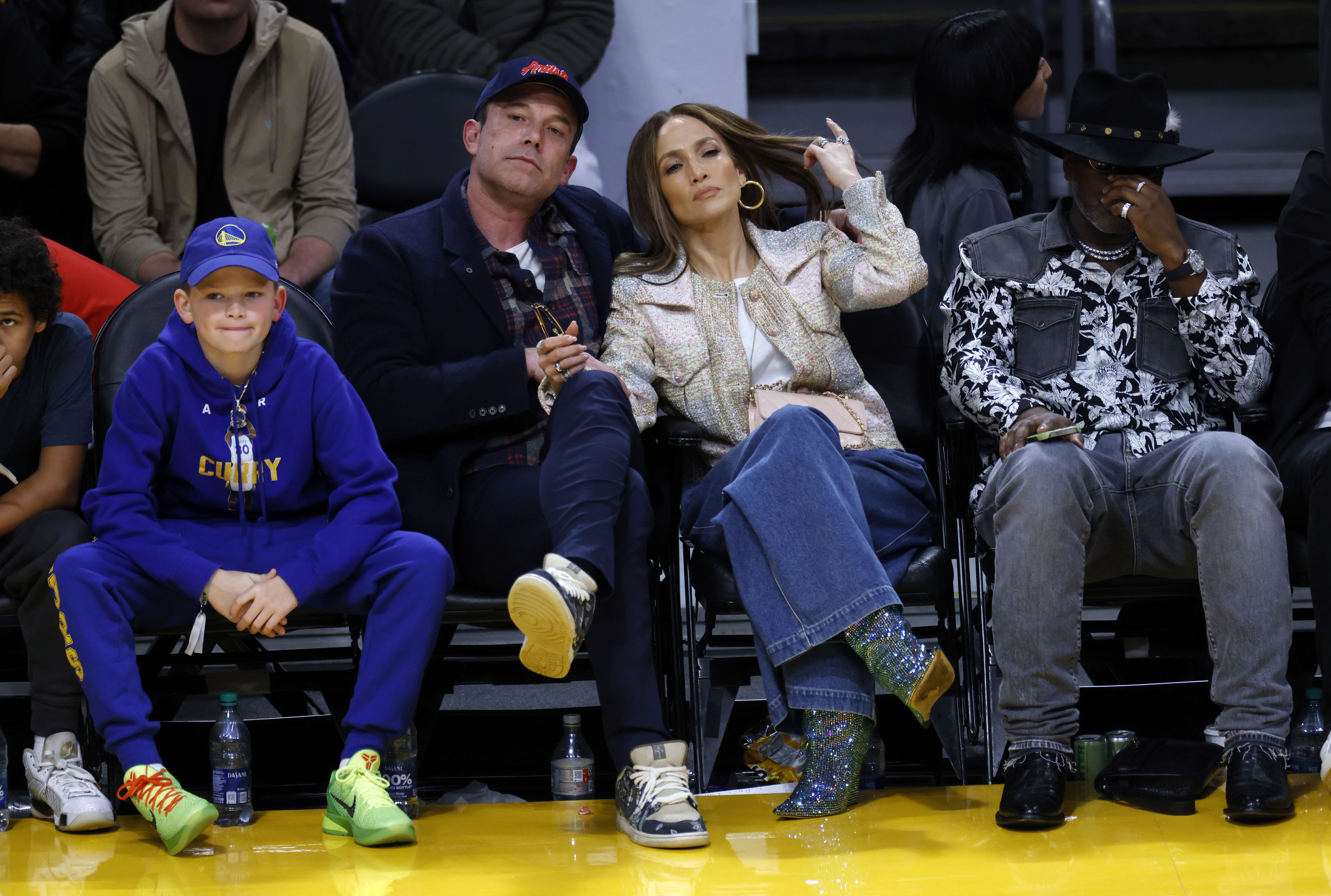 Samuel Garner Affleck, Ben Affleck and Jennifer Lopez attend a basketball game between the Los Angeles Lakers and Golden State Warriors at Crypto.com Arena on March 16, 2024, in Los Angeles, California. | Source: Getty Images