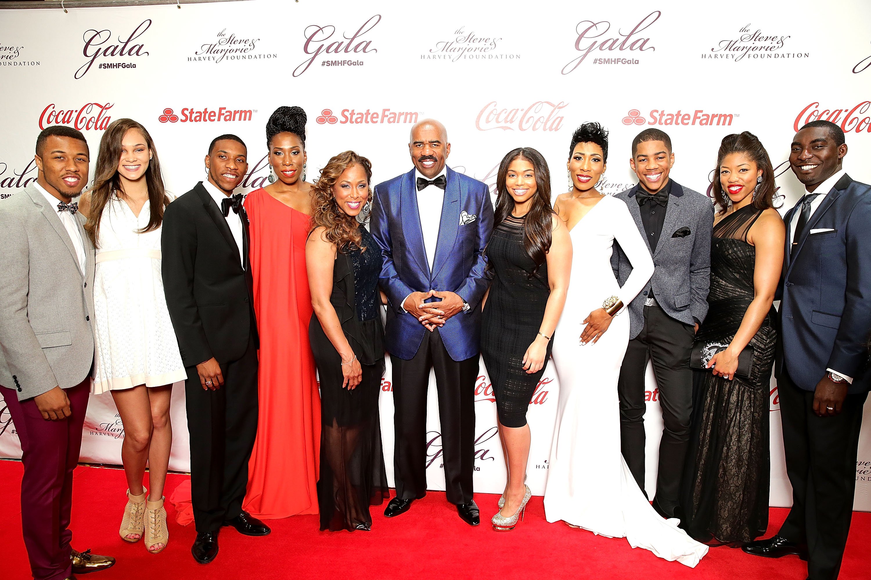 (L-R) Jason Harvey, Amanda Harvey, Broderick Harvey Jr., Brandi Harvey, Marjorie Harvey, Steve Harvey, Lori Harvey, Karli Harvey, Wynton Harvey, Morgan Hawthorne & Kareem Hawthorne at the Steve & Marjorie Harvey Foundation Gala on May 3, 2014 in Chicago | Photo: Getty Images