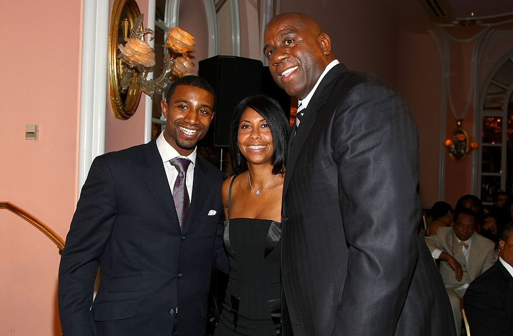 Former NBA player Earvin 'Magic' Johnson, (R) his wife Cookie (C) and their son Andre Johnson attend the USA TODAY Hollywood Hero | Getty Images