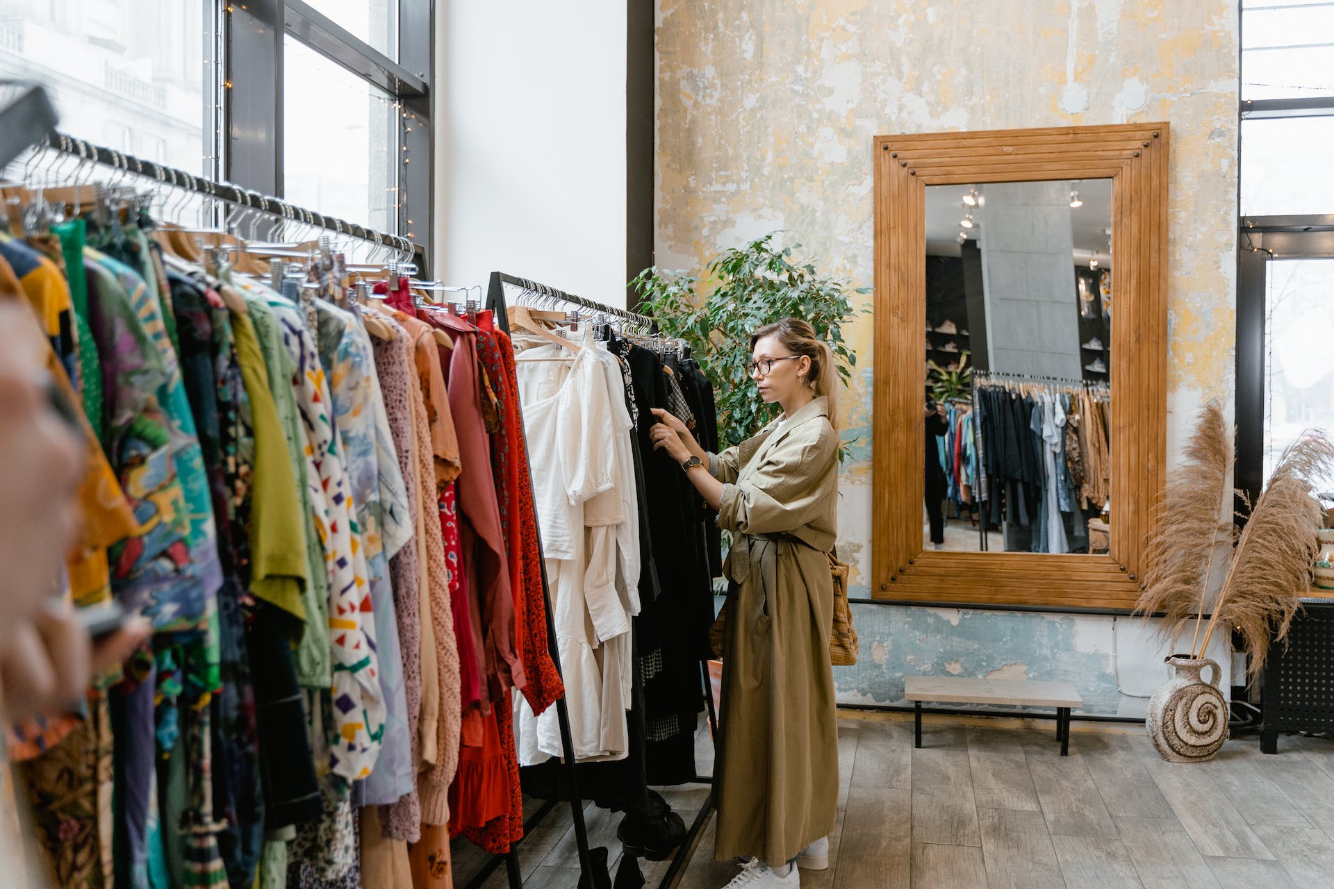 Woman browsing a clothing store | Source: Pexels