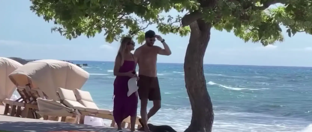 A screenshot from a YouTube video of Christine Baumgartner and Josh Connor in Hawaii posted on July 24, 2023 | Source: YouTube/TMZ