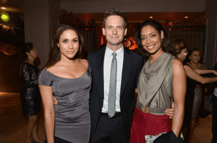 "Suits" cast members: Meghan Markle, Patrick J. Adams and Gina Torres pose at a Toronto International Film Festival Party, at Windsor Arms Hotel, on September 11, 2012, in Toronto, Canada | Source: Getty Images (Photo by George Pimentel/WireImage)