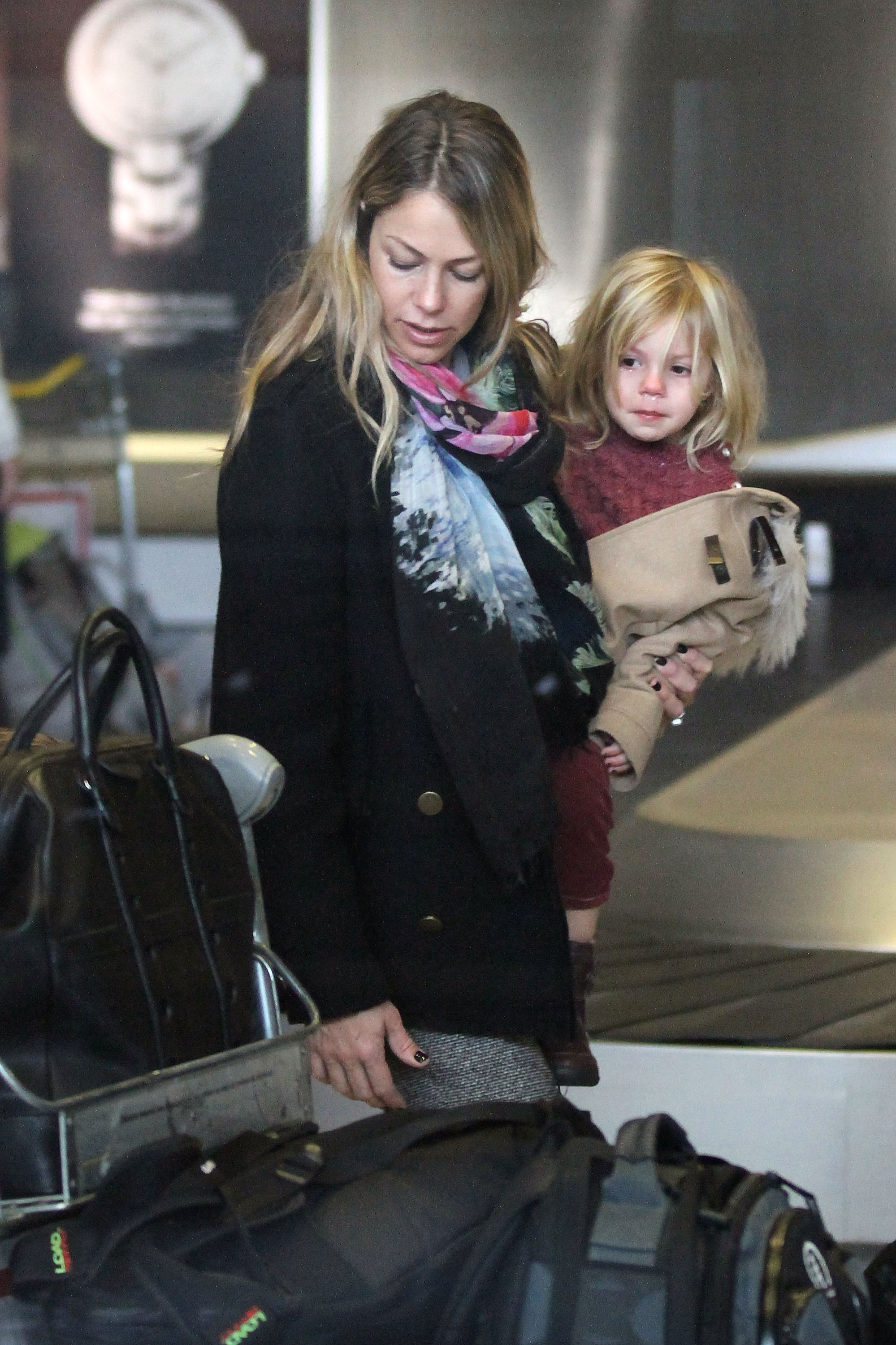 Christine Baumgartner and Grace Costner spotted at Roissy airport in Paris, 2013 | Source: Getty Images