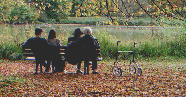 A group of people sitting on a bench | Source: Shutterstock