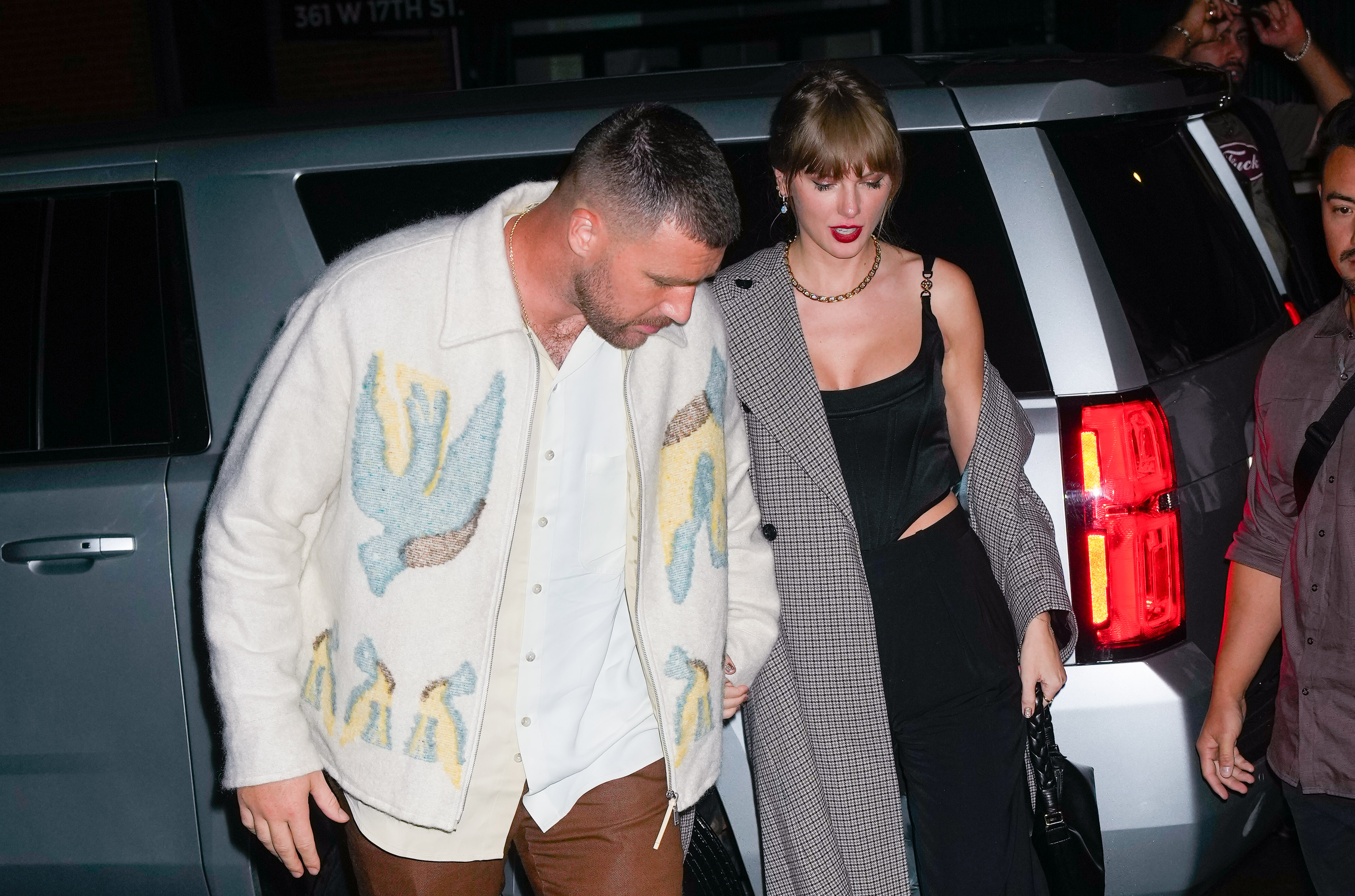 Travis Kelce and Taylor Swift seen leaving the SNL after party on October 15, 2023 in New York | Source: Getty Images
