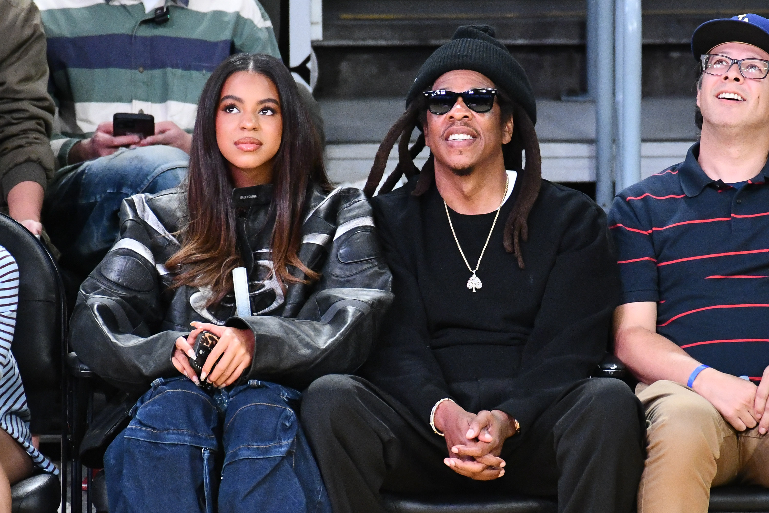 Blue Ivy Carter and Jay-Z attend a basketball game between the Los Angeles Lakers and San Antonio Spurs at Crypto.com Arena in Los Angeles, California, on December 10, 2025 | Source: Getty Images