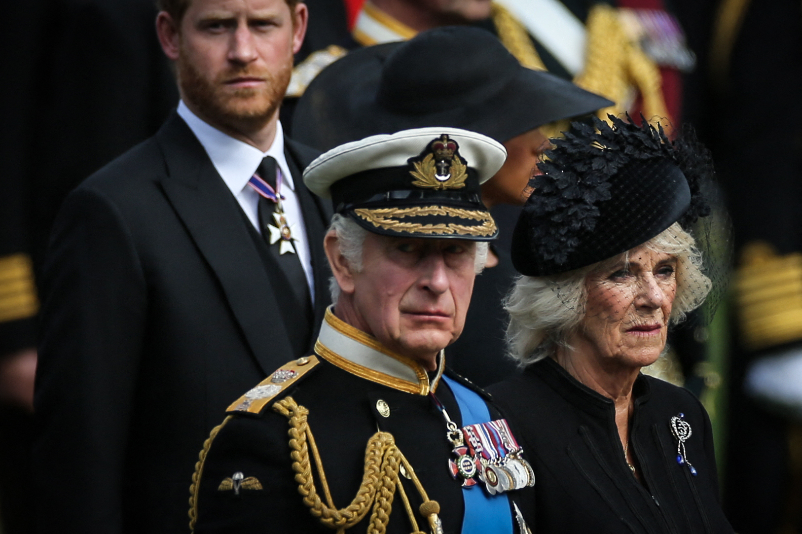 King Charles III, Camilla, Queen Consort and Prince Harry, Duke of Sussex watch as members of the Bearer Party transfer the coffin of Queen Elizabeth II, on September 19, 2022 | Source: Getty Images