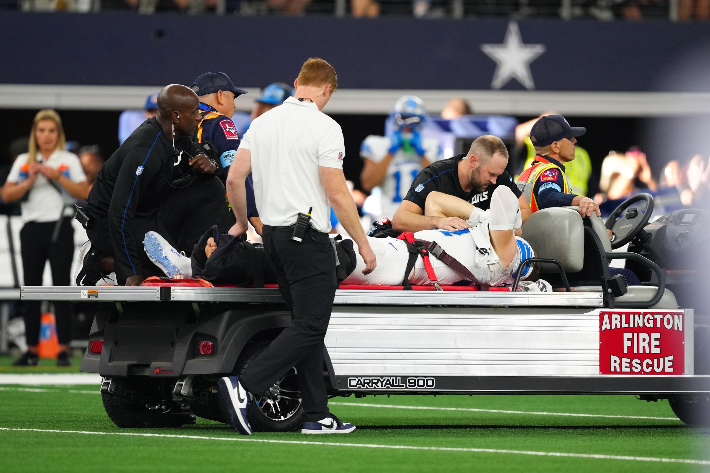 Aidan Hutchinson #97 of the Detroit Lions is taken off the field on a medical cart after injuring his leg on October 13, 2024 | Source: Getty Images