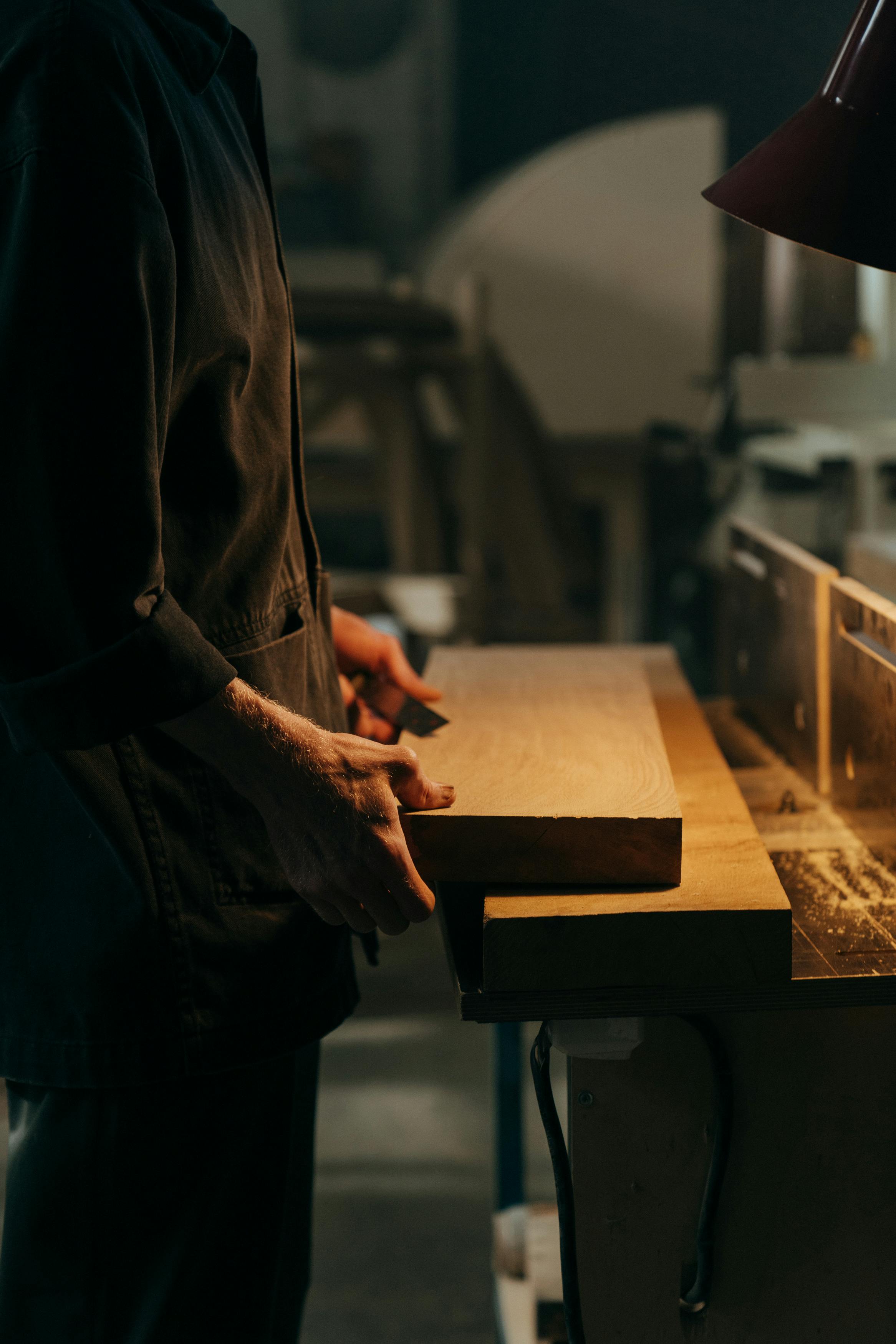 A man holding wooden panels | Source: Pexels