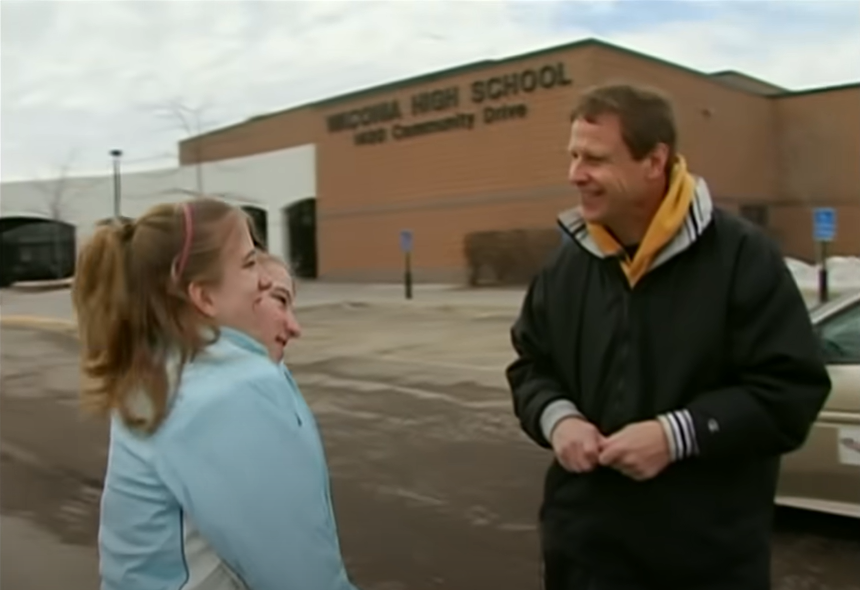 Abby and Brittany Hensel meet their driving instructor, from a video post dated December 2, 2022 | Source: YouTube/Origin