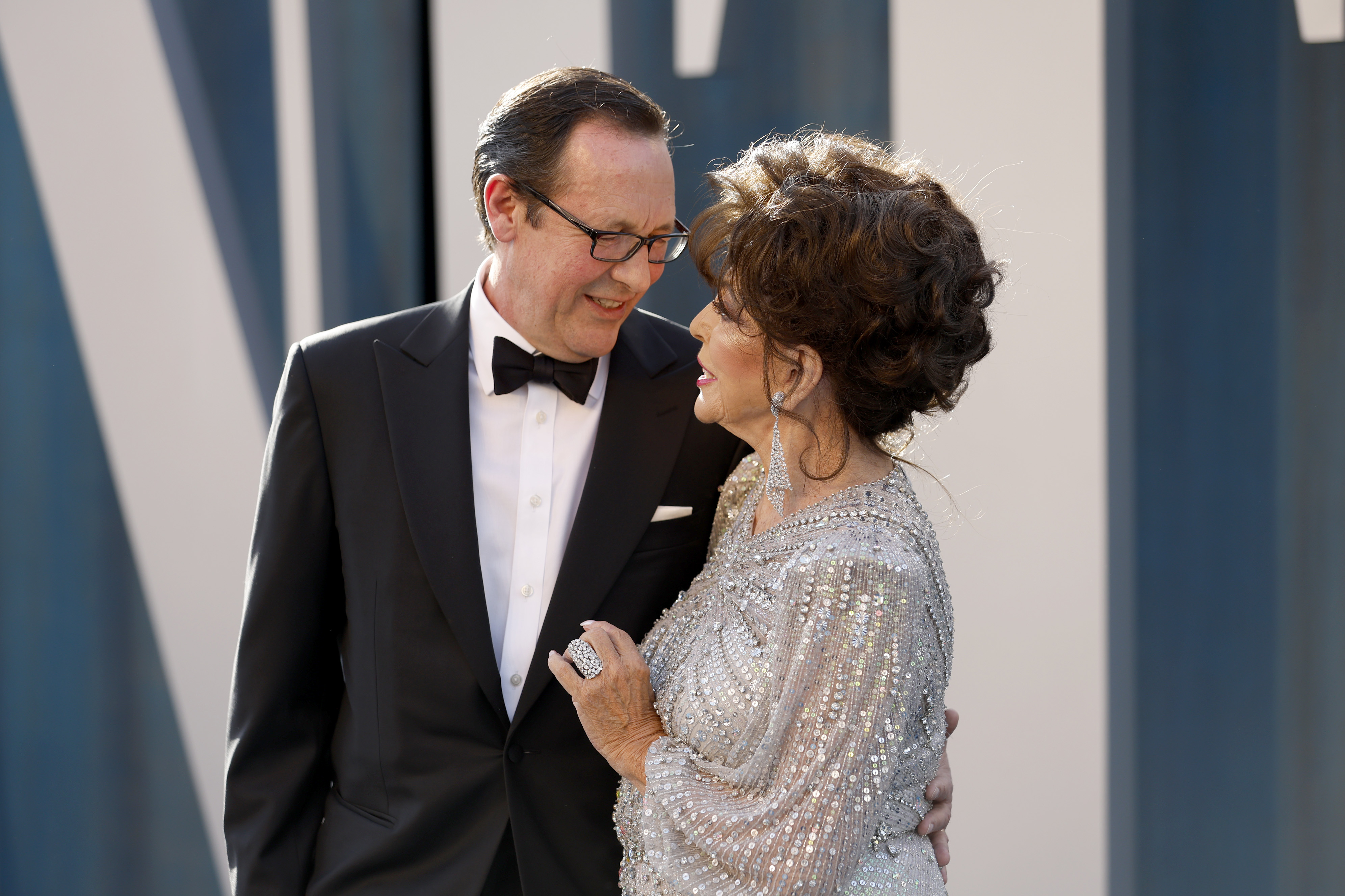 Percy Gibson and Joan Collins at the 2022 Vanity Fair Oscar Party at Wallis Annenberg Center for the Performing Arts on March 27, 2022 in Beverly Hills, California. | Sources: Getty Images