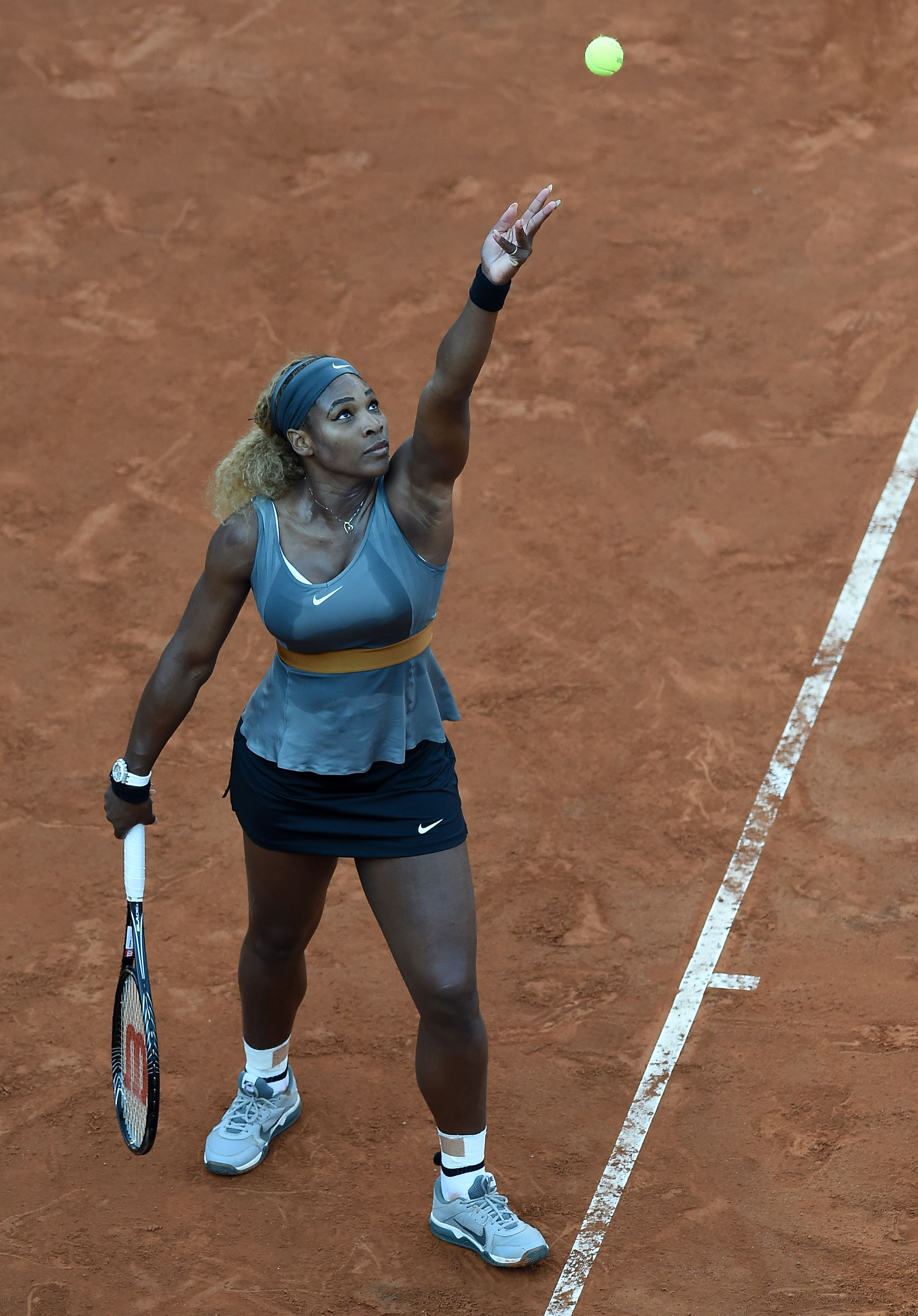 Serena Williams serves in her match against Ana Ivanovic of Serbia during day seven of the Internazionali BNL d'Italia tennis on May 17, 2014 | Source: Getty Images