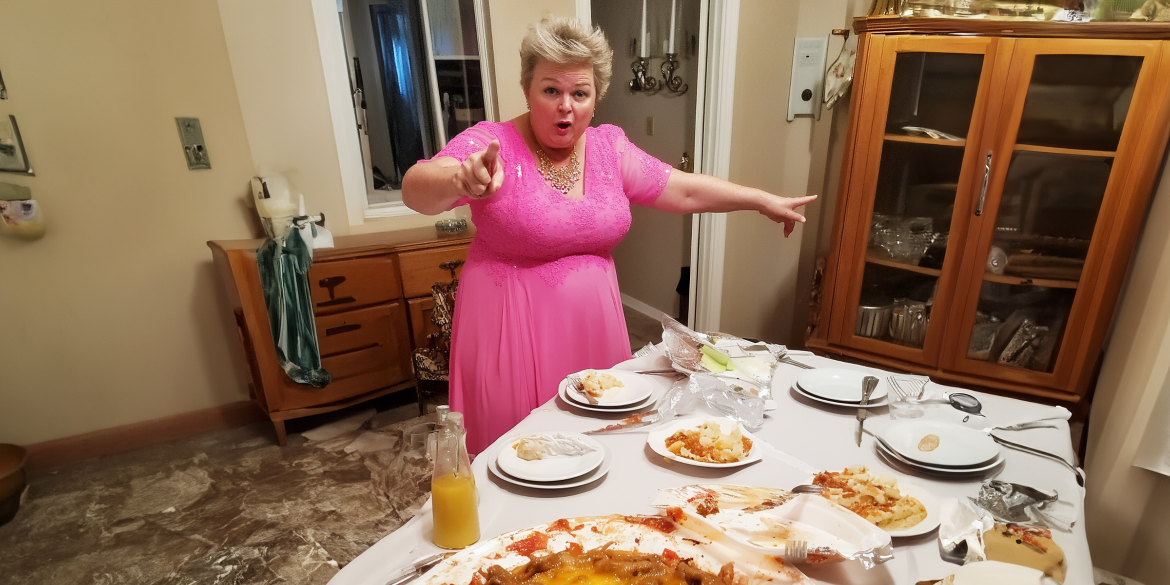 An angry woman standing at a dinner table | Source: 