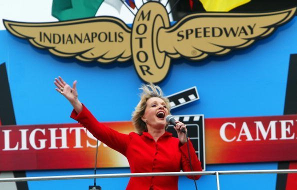 Florence Henderson sings "God Bless America" during the IRL IndyCar Series 88th running of the Indianapolis 500 on May 30, 2004, at Indianapolis Motor Speedway in Indianapolis, Indiana. | Source: Getty Images.
