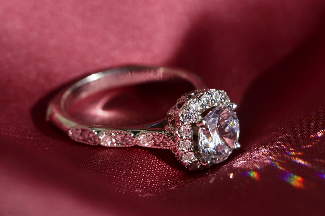 An ancient-looking ring with a white gem that didn't sparkle dropped out of the purse when Rose dusted it  | Source: Pexels