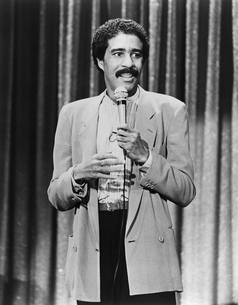 Comedian Richard Pryor performing his stand-up comedy in a scene from the movie "Richard Pryor: Live on the Sunset Strip." [Location and date unspecified] │ Source: Getty Images