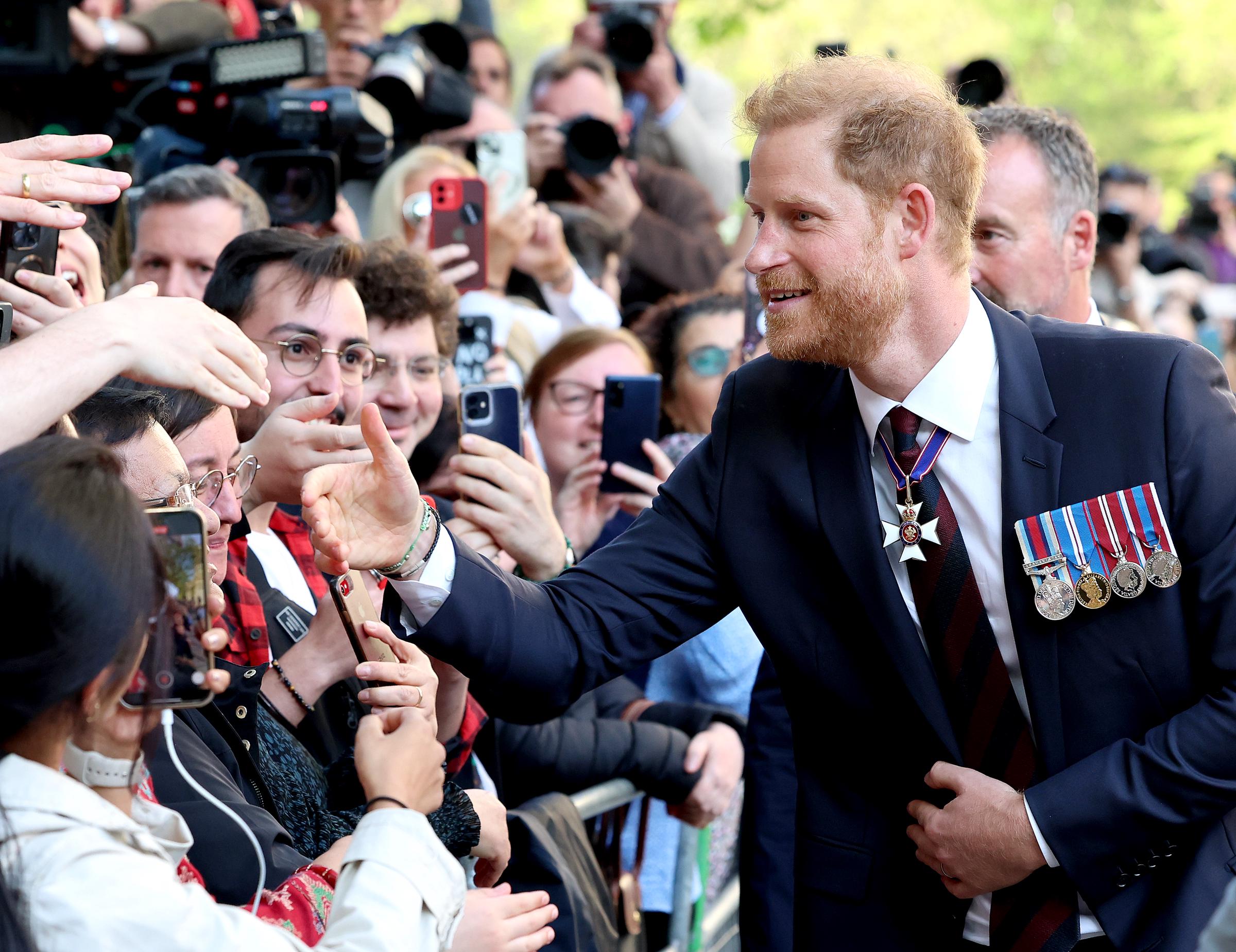 Prince Harry meets the public as he leaves The Invictus Games Foundation's 10th Anniversary Service at St. Paul's Cathedral in London on May 8, 2024 | Source: Getty Images