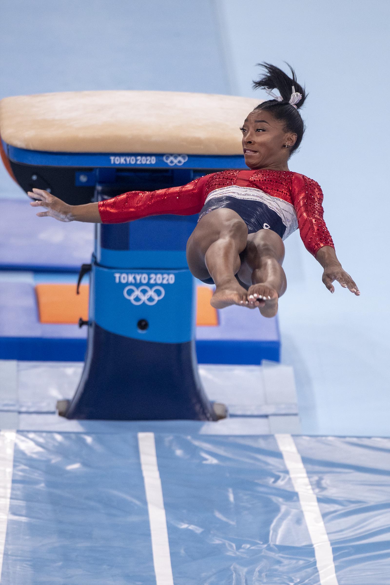 Simone Biles performs on the vault apparatus where she lands awkwardly during the Women's Team final at the Tokyo 2020 Summer Olympic Games in Tokyo, Japan, on July 27, 2021. | Source: Getty Images