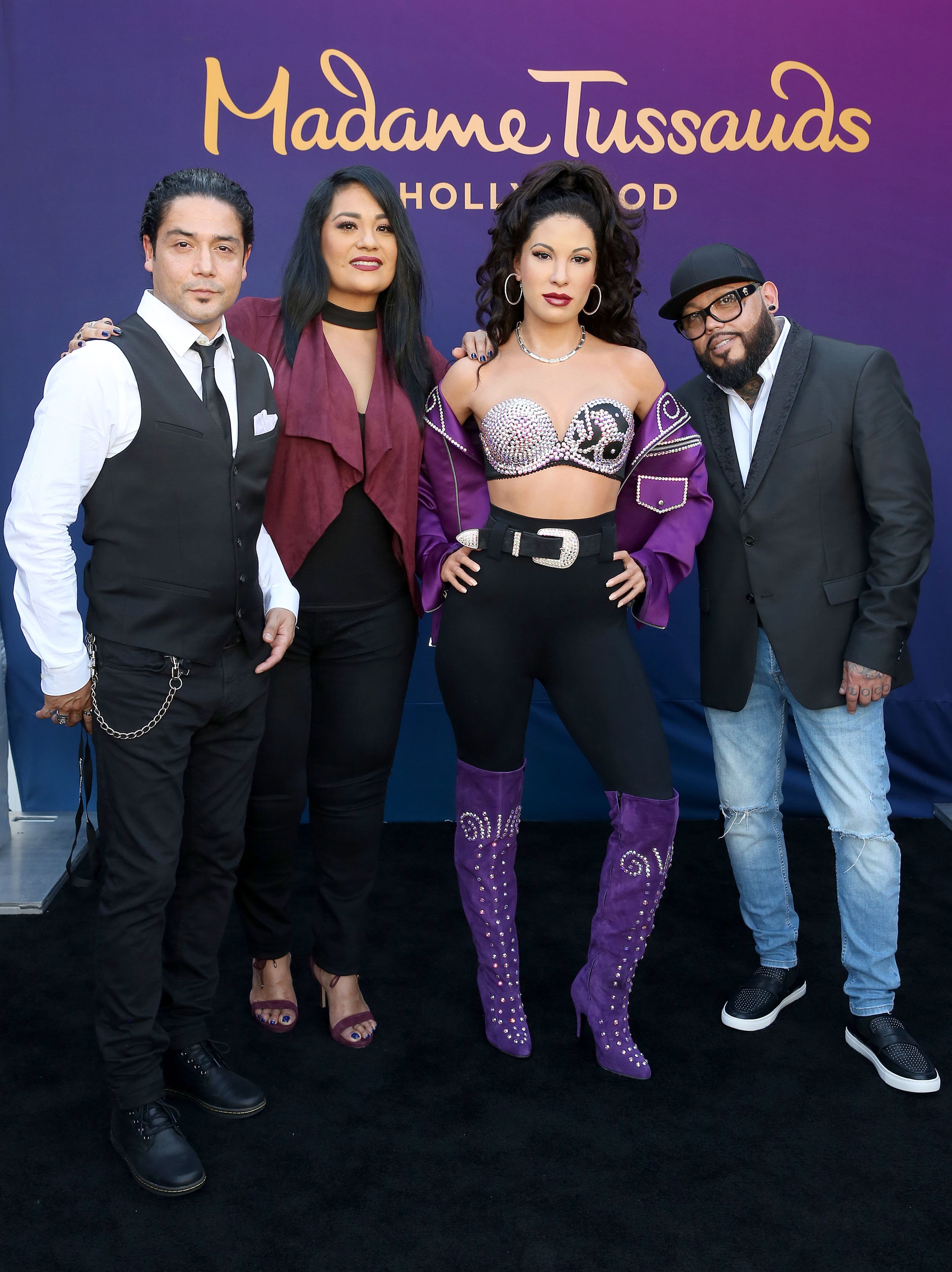 Selena's husband Chris Perez, sister Suzette Quintanilla and brother AB Quintanilla onstage during Madame Tussauds Hollywood's unveiling of Grammy award winner and cultural icon Selena Quintanilla immortalized in wax at Madame Tussauds on August 30, 2016 in Hollywood, California. | Photo: Getty Images