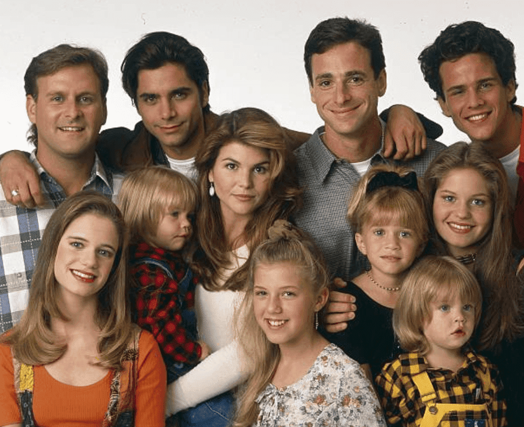 "Full House" Season Seven cast pose for a promotional picture, which includes; Dave Coulier, Andrea Barber, John Stamos, Blake Tuomy-Wilhoit , Lori Loughlin, Jodie Sweetin, Bob Saget, Ashley Olsen, Dylan Tuomy-Wilhoit, Candace Cameron and Scott Weinger, on September 14 1993 | Source: Bob D'Amico/Walt Disney Television via Getty Images