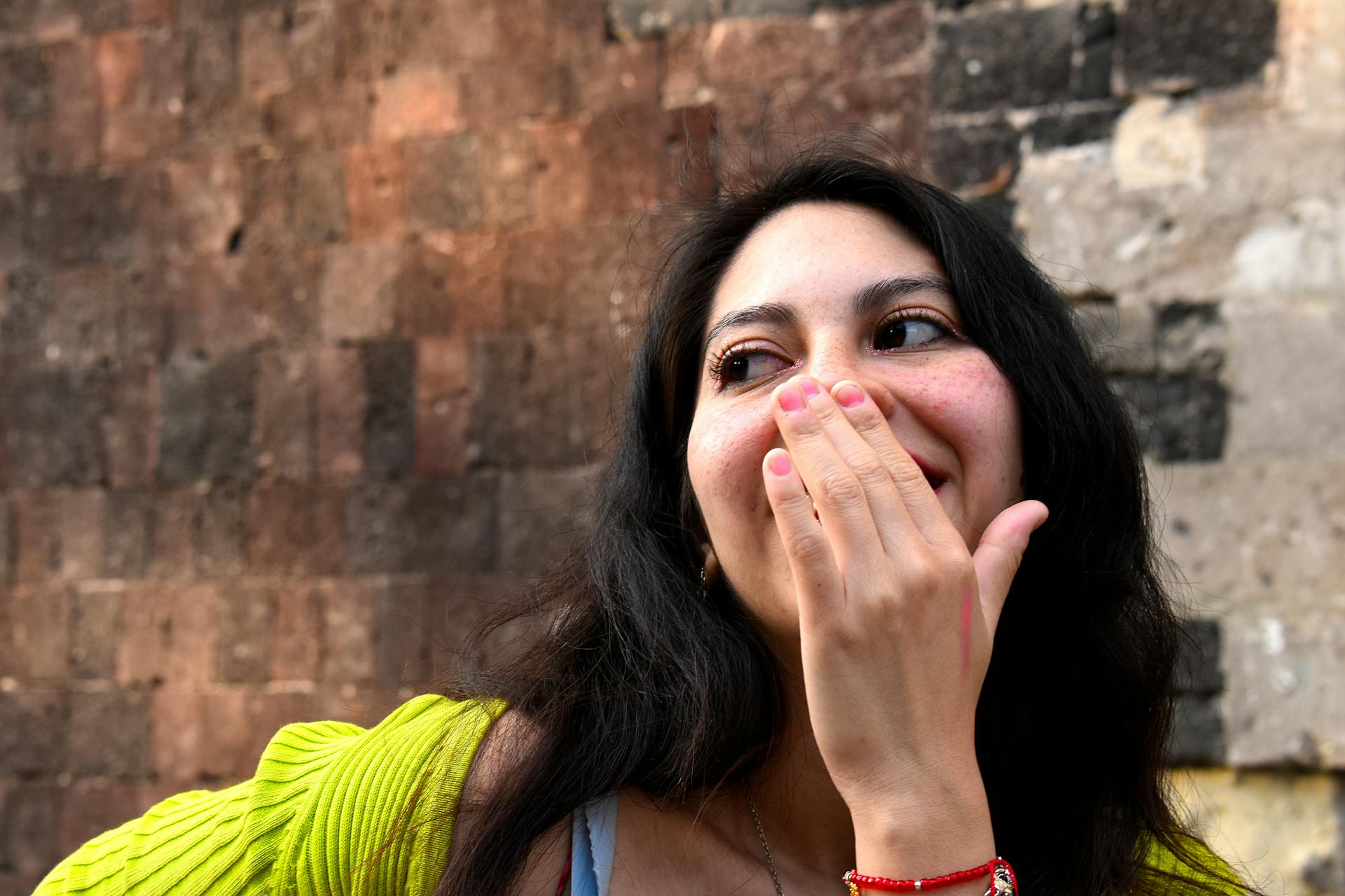 A young woman laughing | Source: Pexels