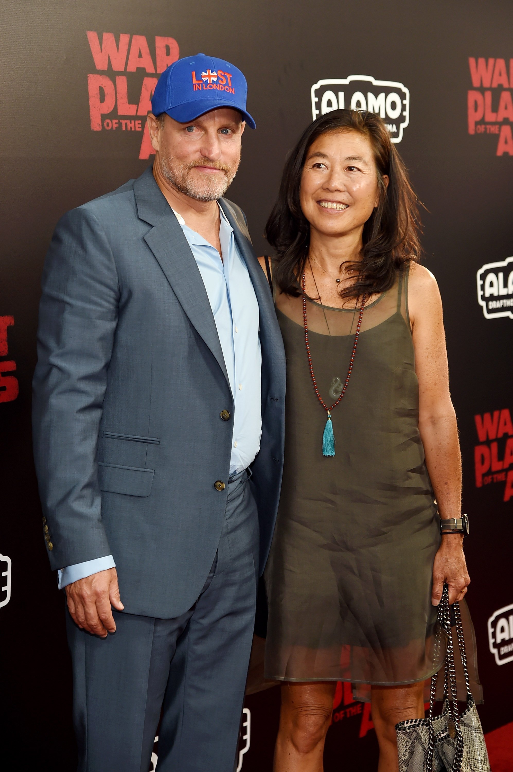 Woody Harrelson and Laura Louie attend "War for the Planet Of The Apes" premiere at SVA Theater on July 10, 2017, in New York City. | Source: Getty Images.