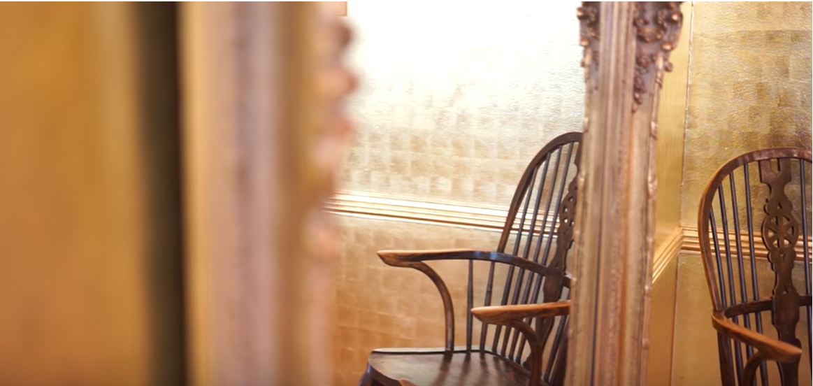 An atique chair in Donna Mill's home | Source:Source: YouTube/@LosAngelesTimes