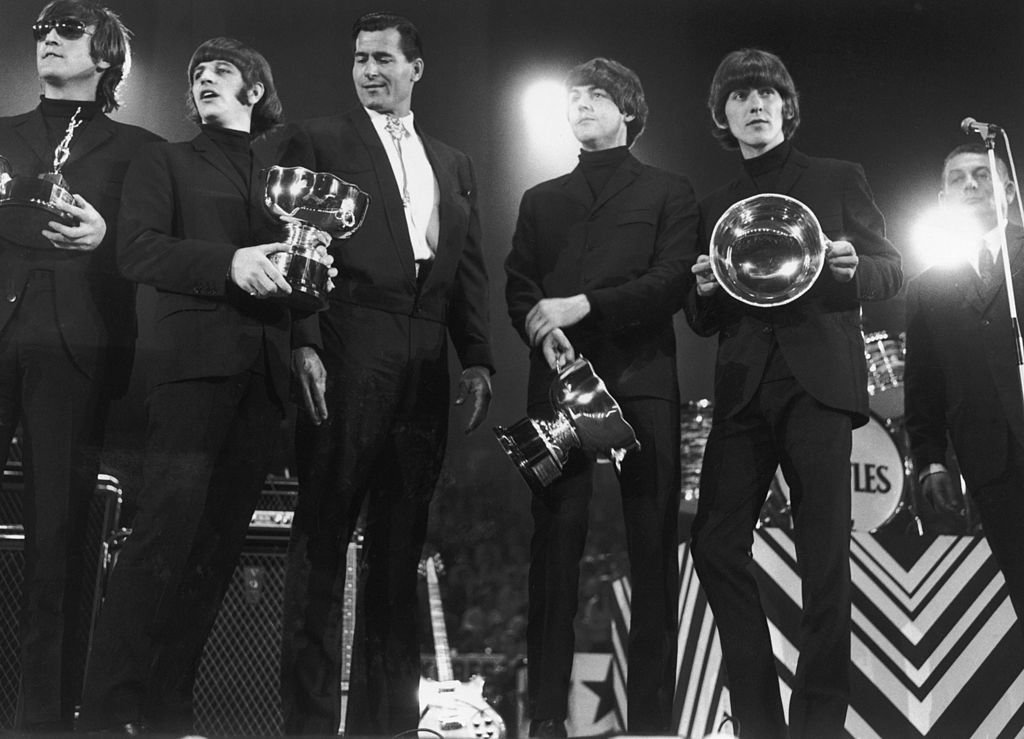 The Beatles collect their awards at the NME Poll Winners Concert in Wembley, 1st May 1966 | Getty Images / Global Images Ukraine The Beatles collect their awards at the NME Poll Winners Concert in Wembley, 1st May 1966 | Getty Images / Global Images Ukraine
