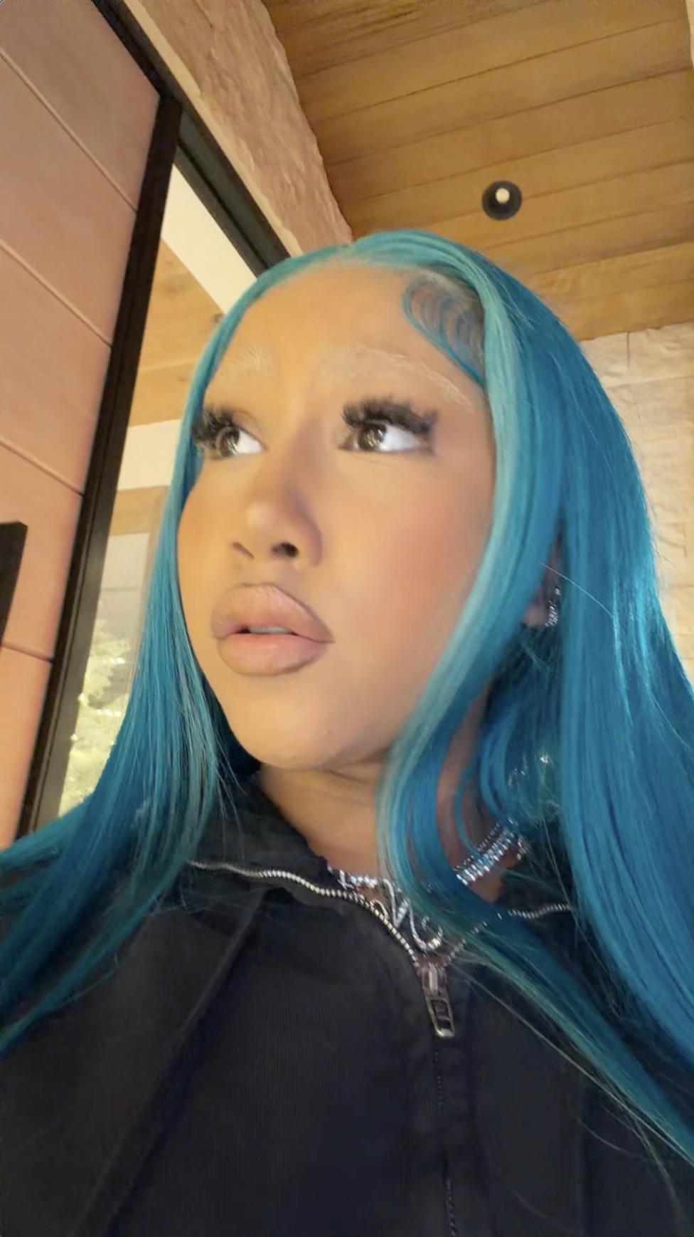 North West looks off-camera with long blue hair and styled baby hairs | Source: TikTok/kimandnorth