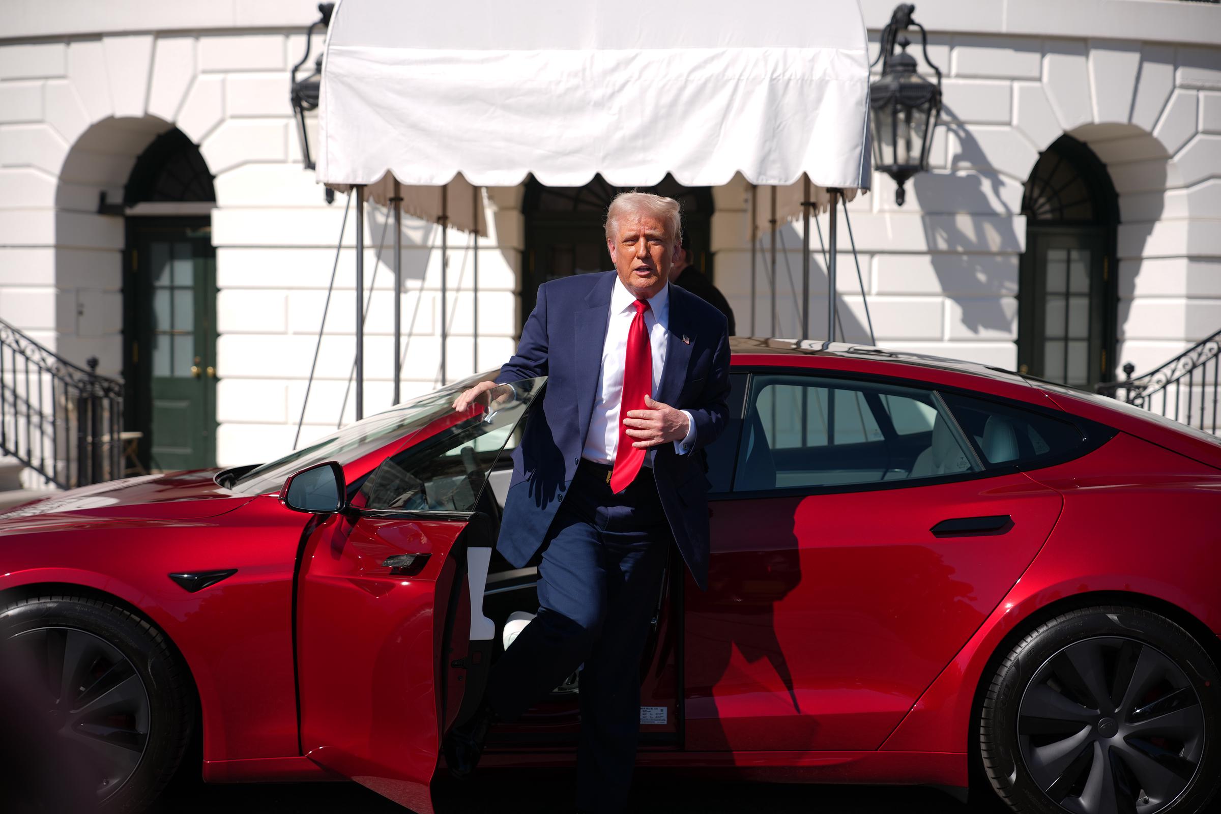 U.S. President Donald Trump gets out of a Tesla Model S on the South Lawn of the White House on March 11, 2025, in Washington, D.C. | Source: Getty Images